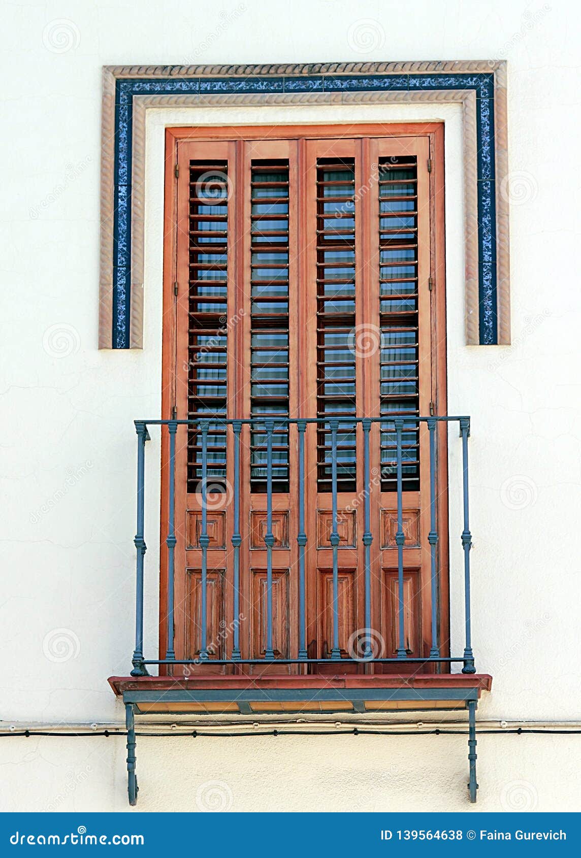 beautiful window with shutters and small balcony in dos hermanos