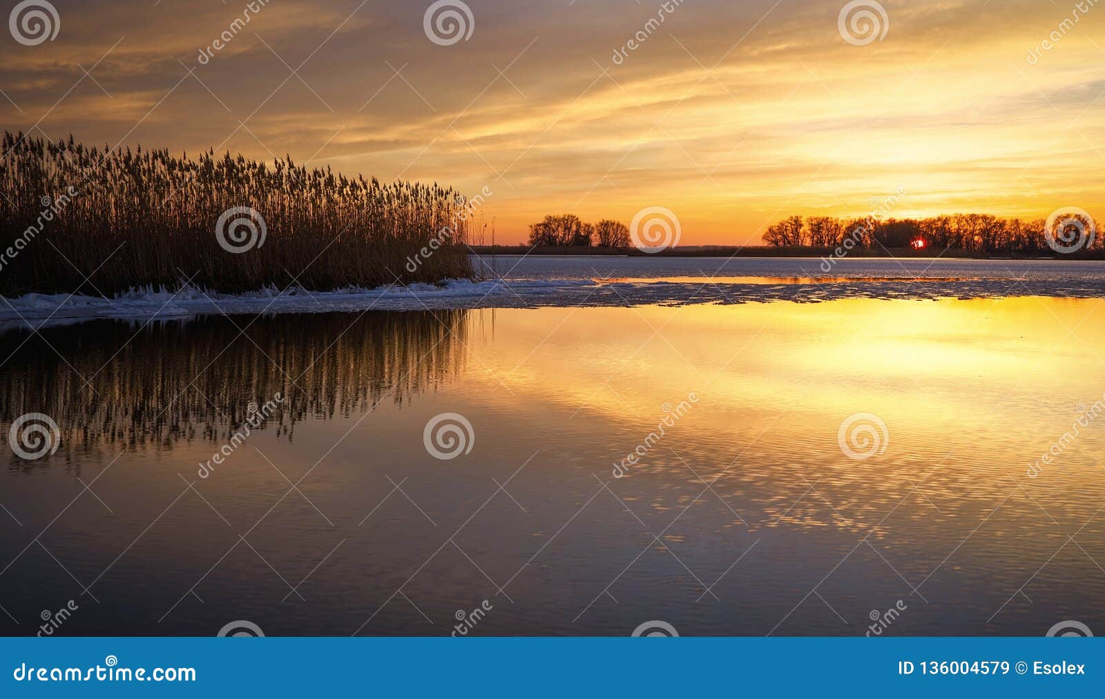 Beautiful Winter Landscape with Frozen River, Reeds and Sunset Sky ...