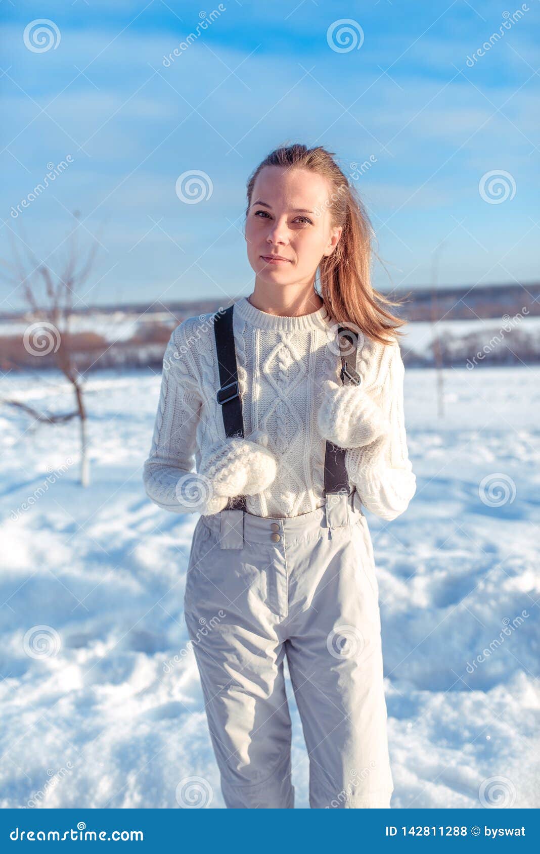 Beautiful Winter Woman in White Jumpsuit and Warm Mittens. Posing in ...