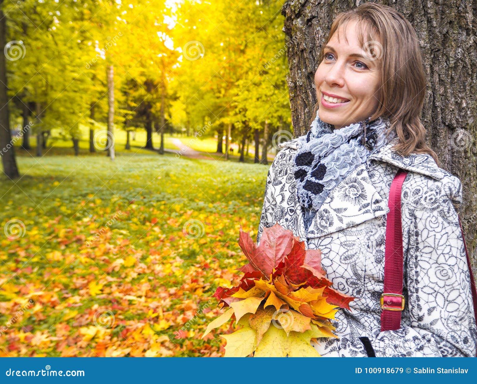 Beautiful Woman in Autumn Park. Woman in Autumn Park with Colorful ...
