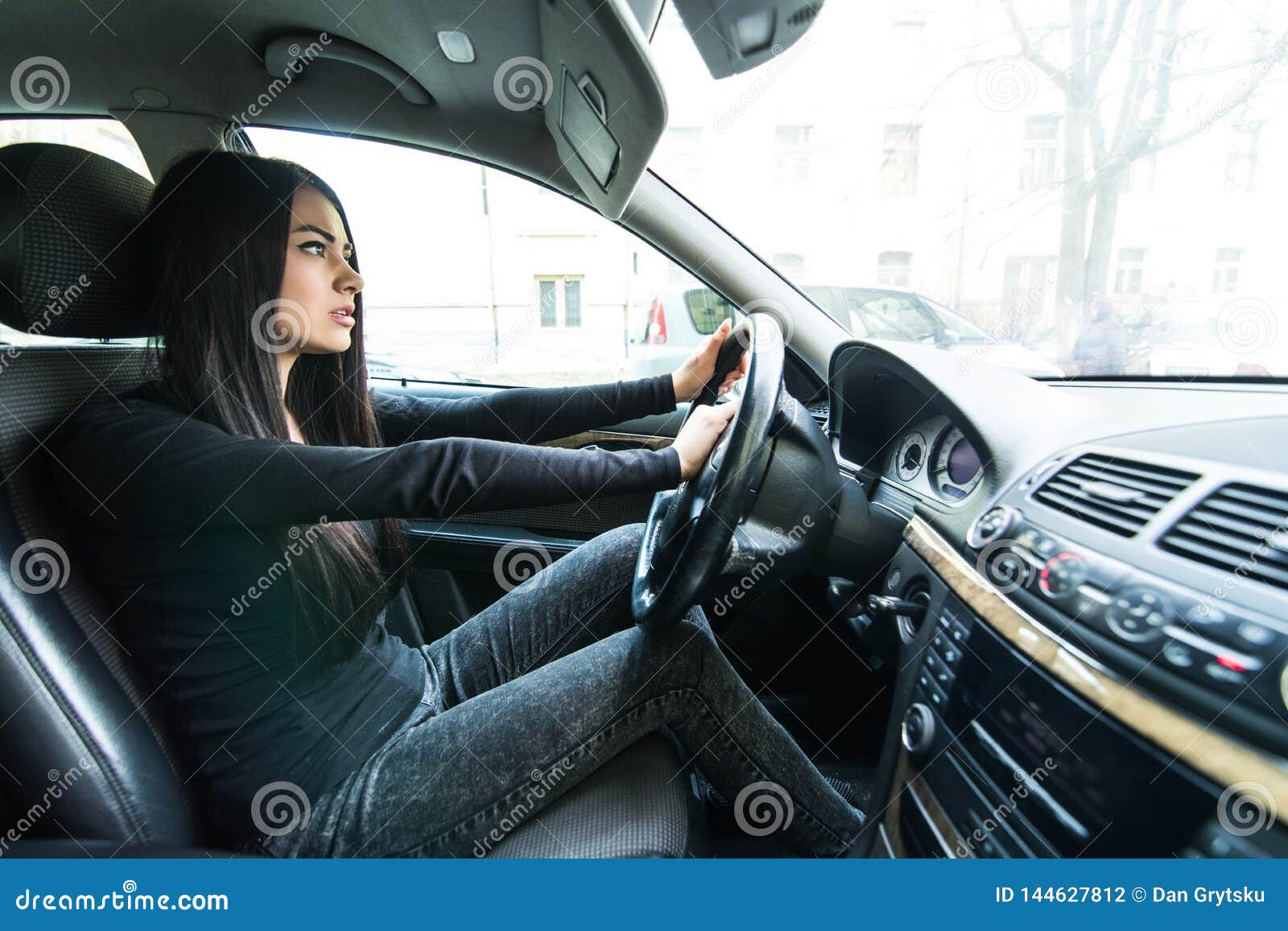 beautiful woman beep in the car in panic while drive