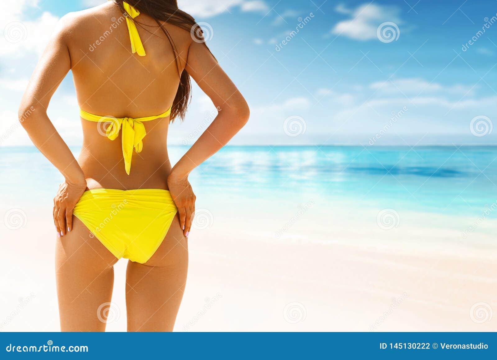 Rubber Bloody Geneigd zijn Beautiful Woman in Bikini Standing with Her Arms Raised To Her Hips  Enjoying Looking View of Ocean on Hot Summer Stock Photo - Image of slim,  sunny: 145130222