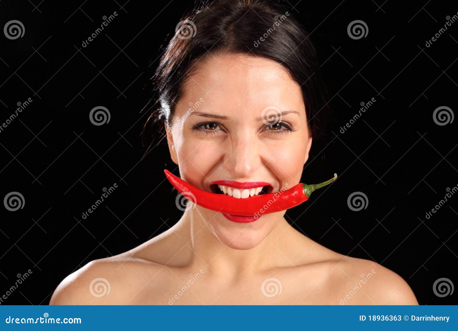 Beautiful Woman Biting On Red Chili Pepper Stock Image