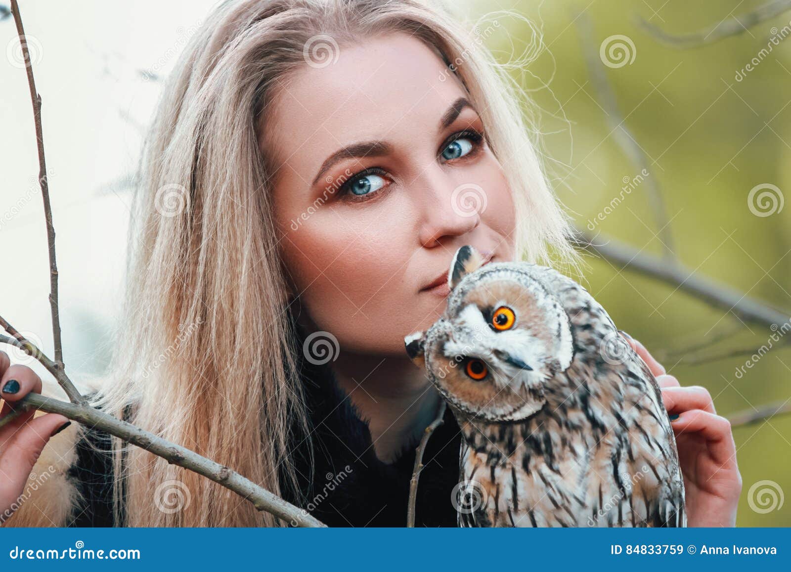 Beautiful Woman in a Black Dress with an Owl on His Arm. Blonde with ...