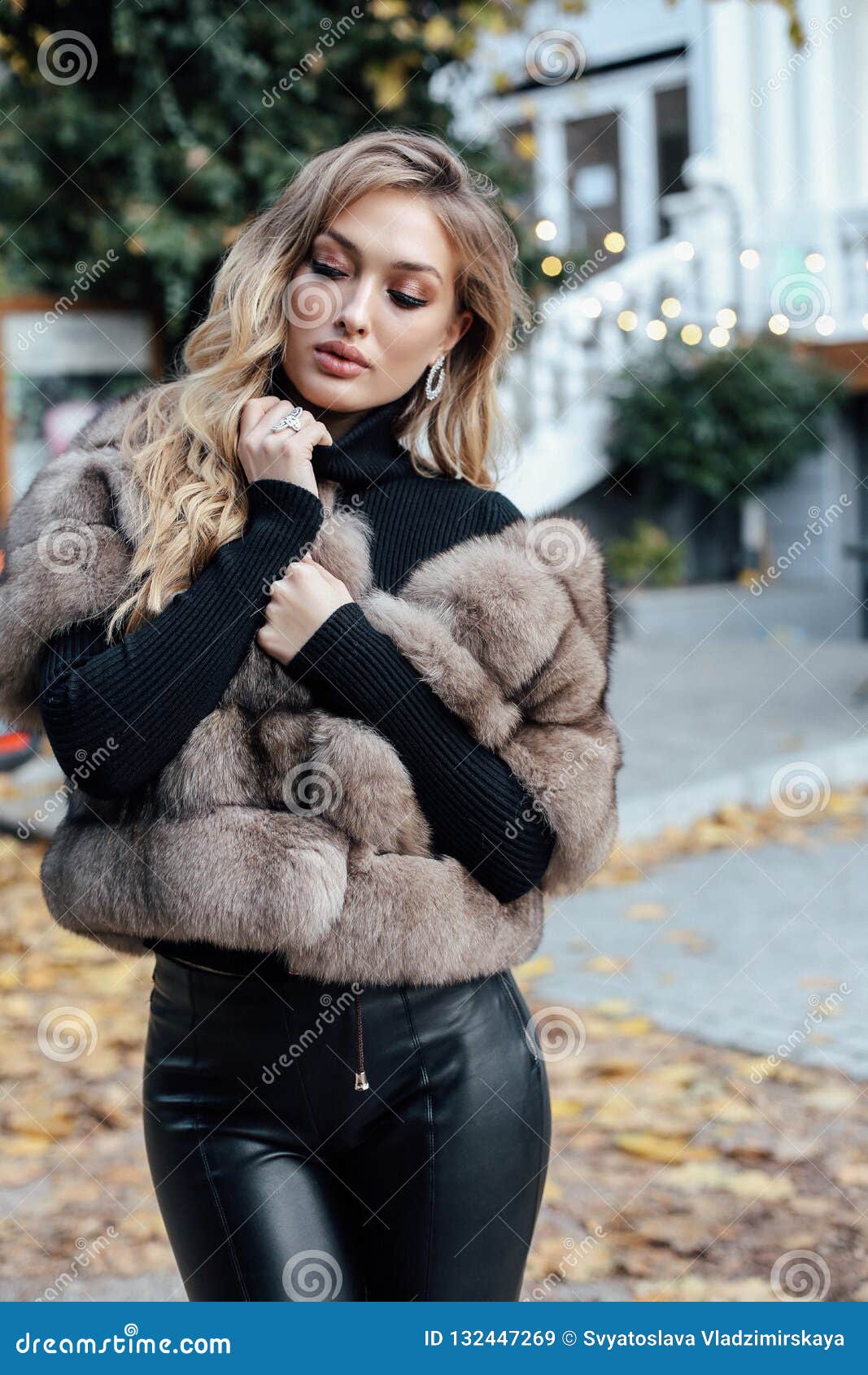 Beautiful Woman with Blond Hair in Luxurious Fur Coat Walking on Stock ...