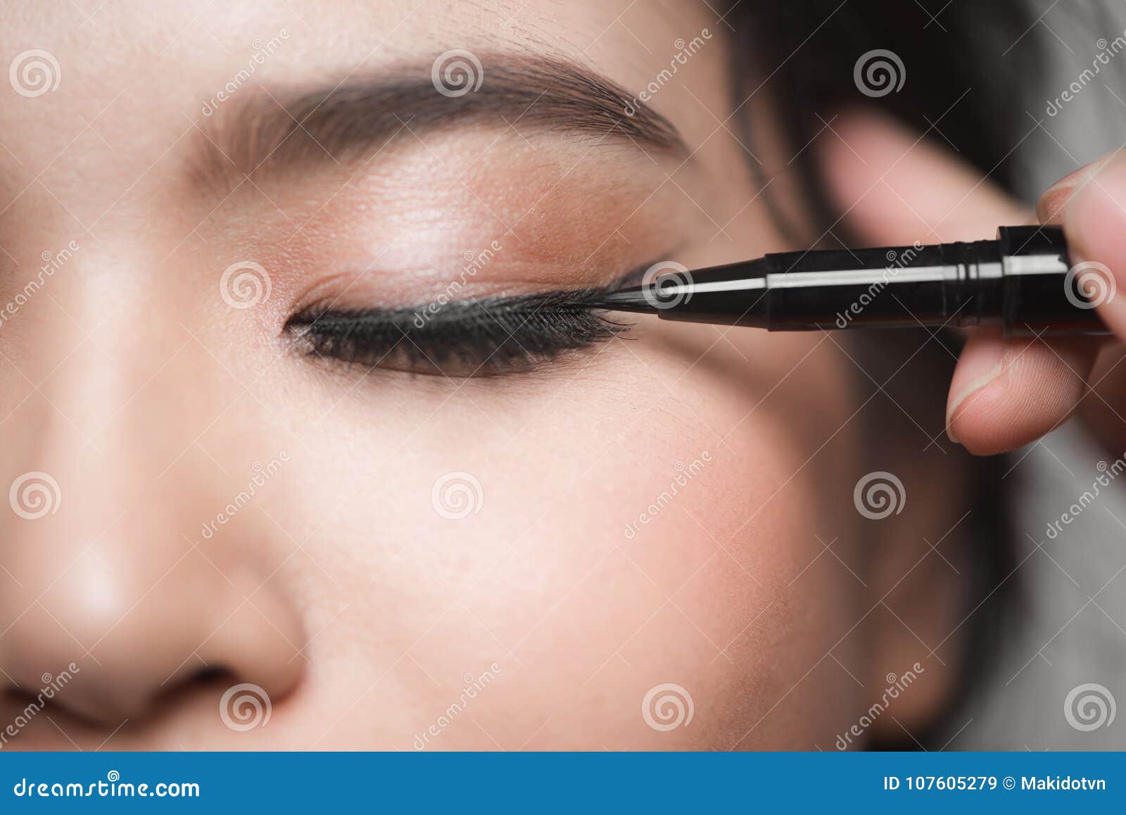 beautiful woman with bright make up eye with black liner makeup