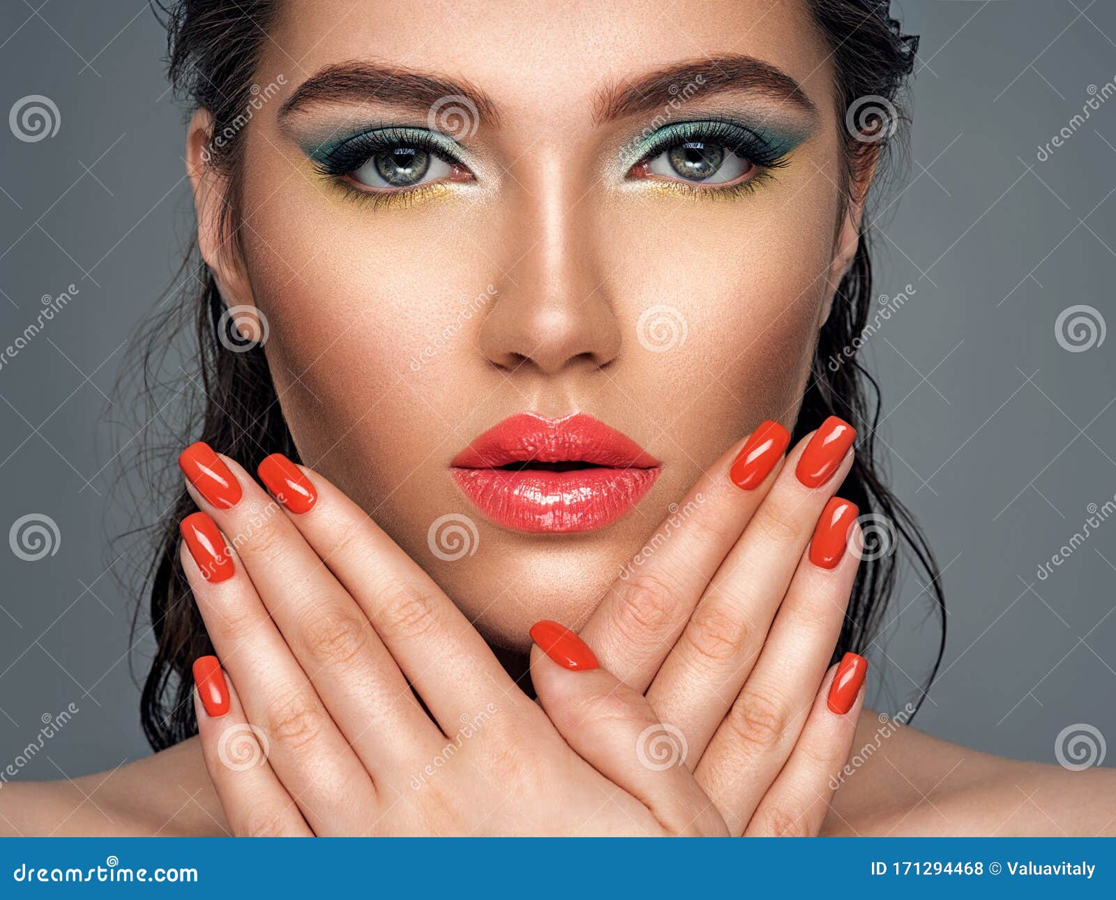 Beautiful Woman With Bright Red Lipstick And Nails