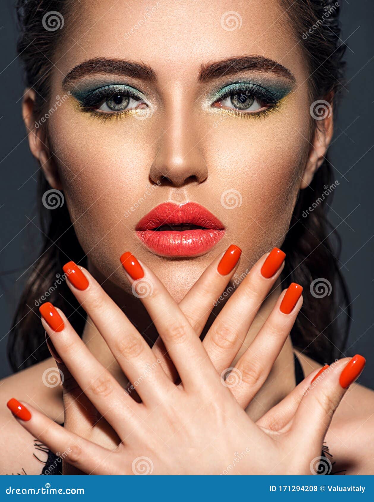 Beautiful Woman With Bright Red Lipstick And Nails