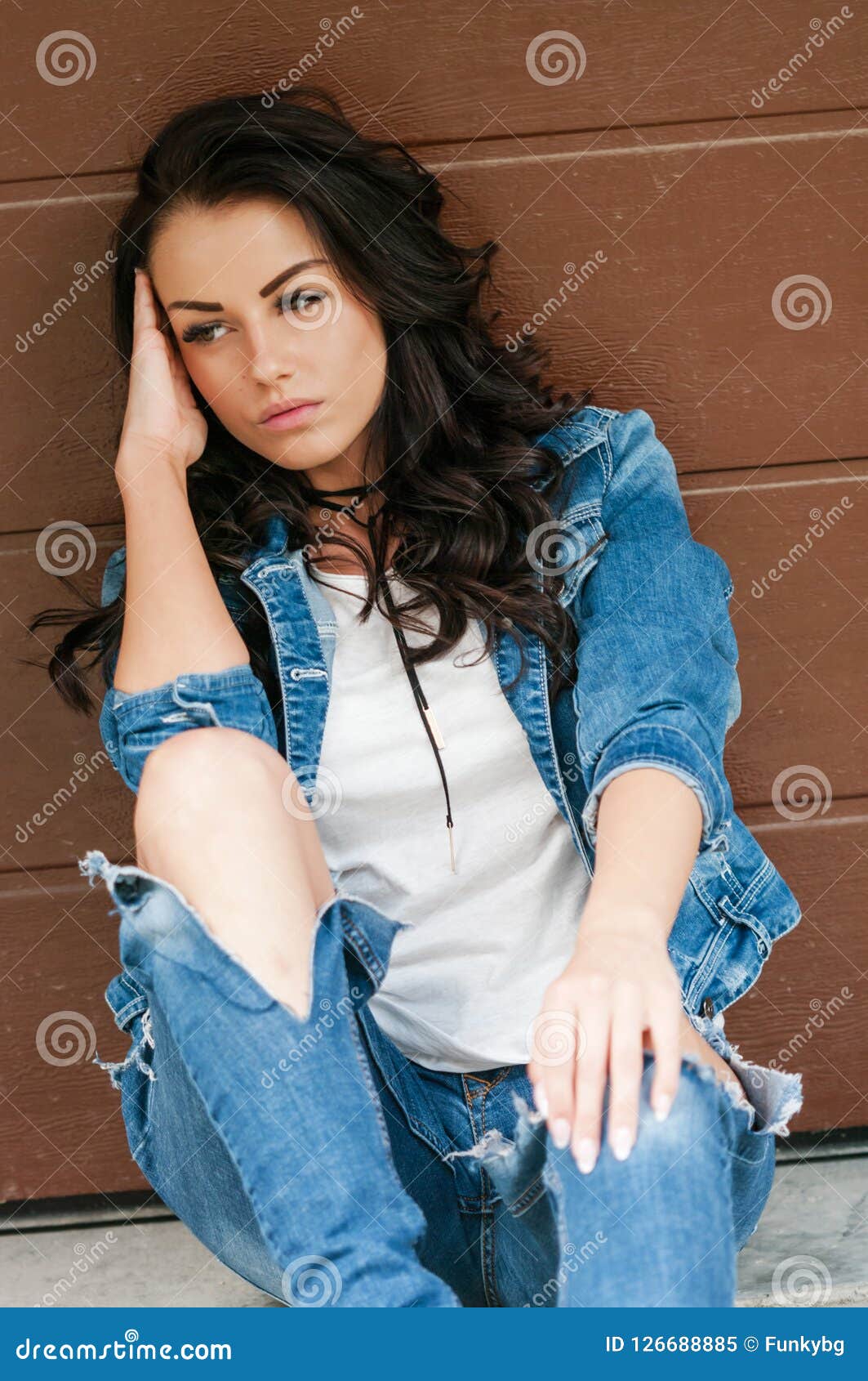 Woman with Brown Hair in Denim Jacket Posing on Camera Stock Image ...