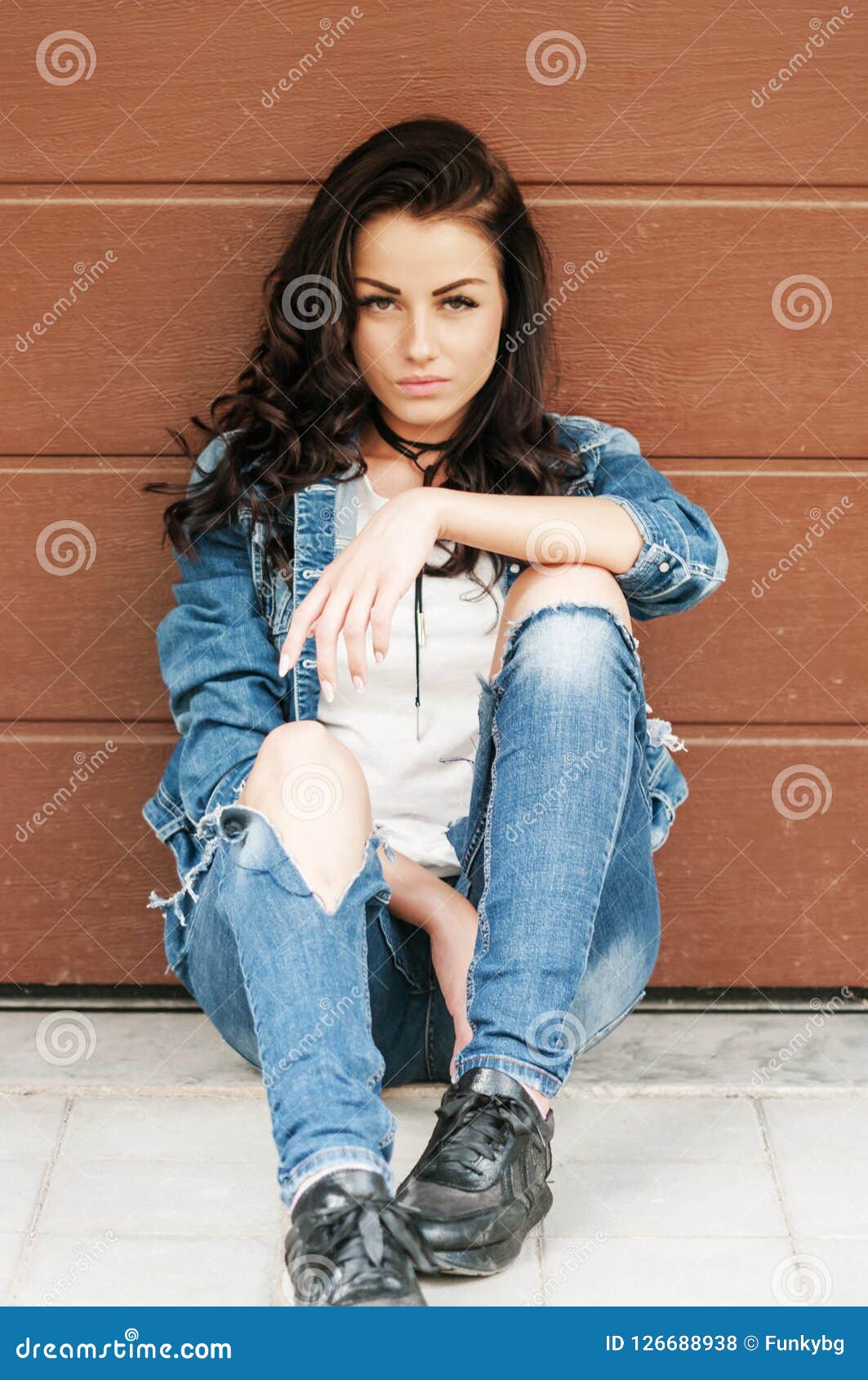 Woman with Brown Hair in Denim Jacket Posing on Camera Stock Photo ...