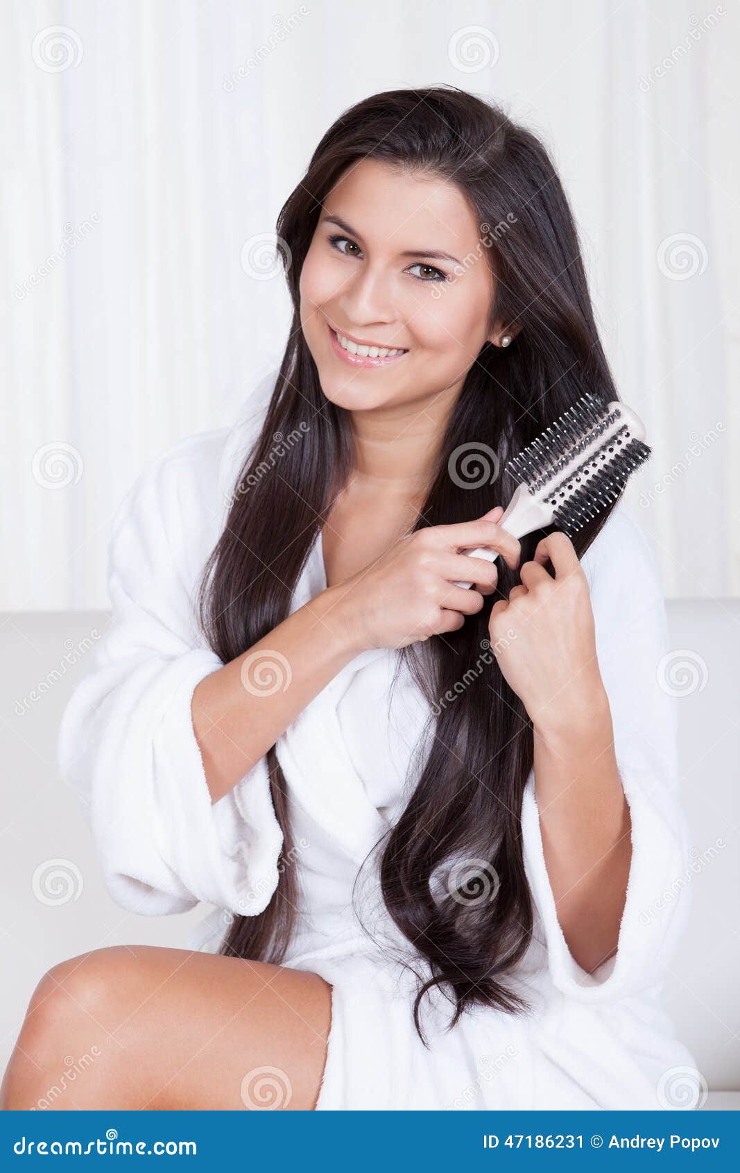 Beautiful Woman Brushing Her Lo