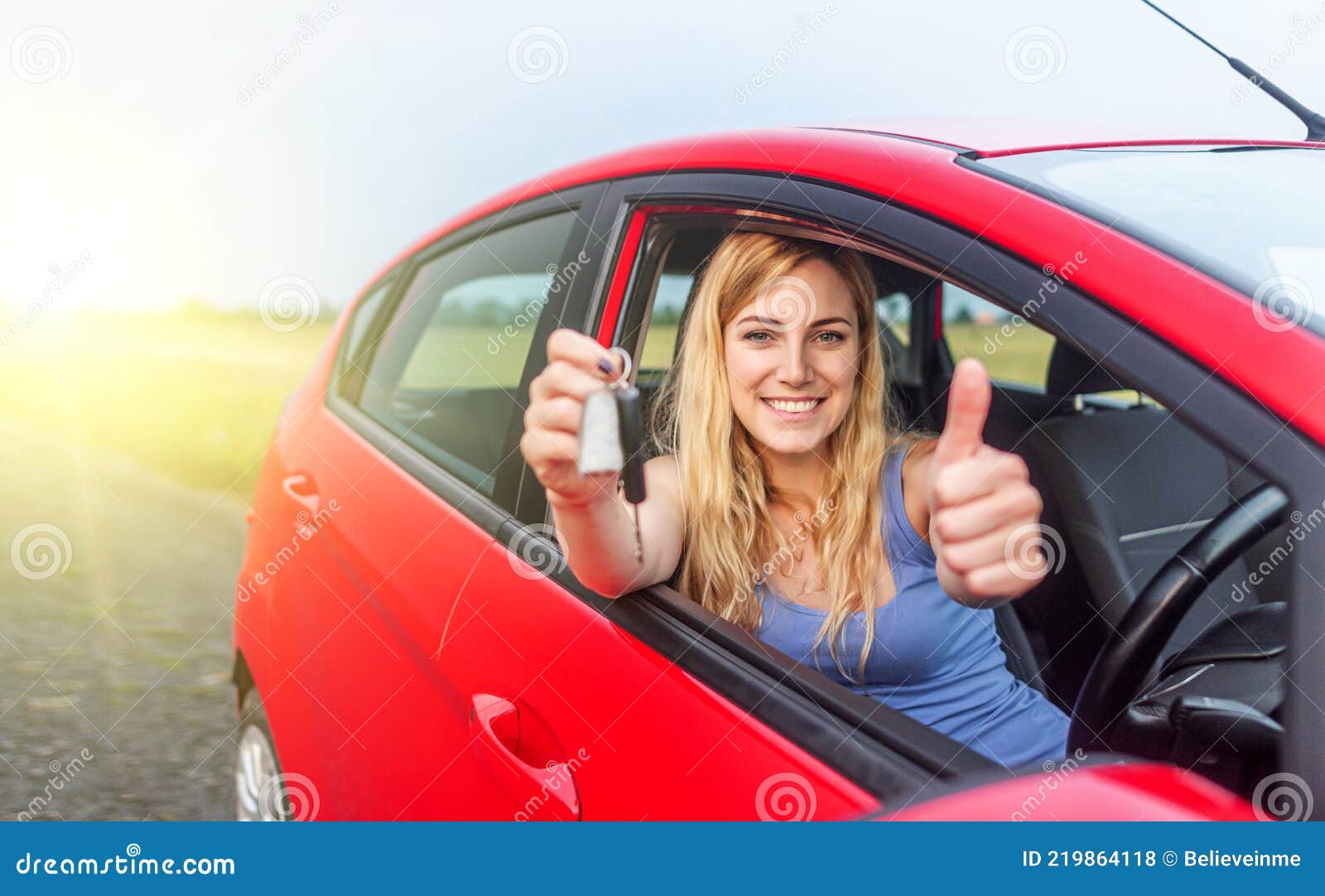 A Beautiful Woman in a Car Holds a Car Key in Her Hands. Stock Photo ...