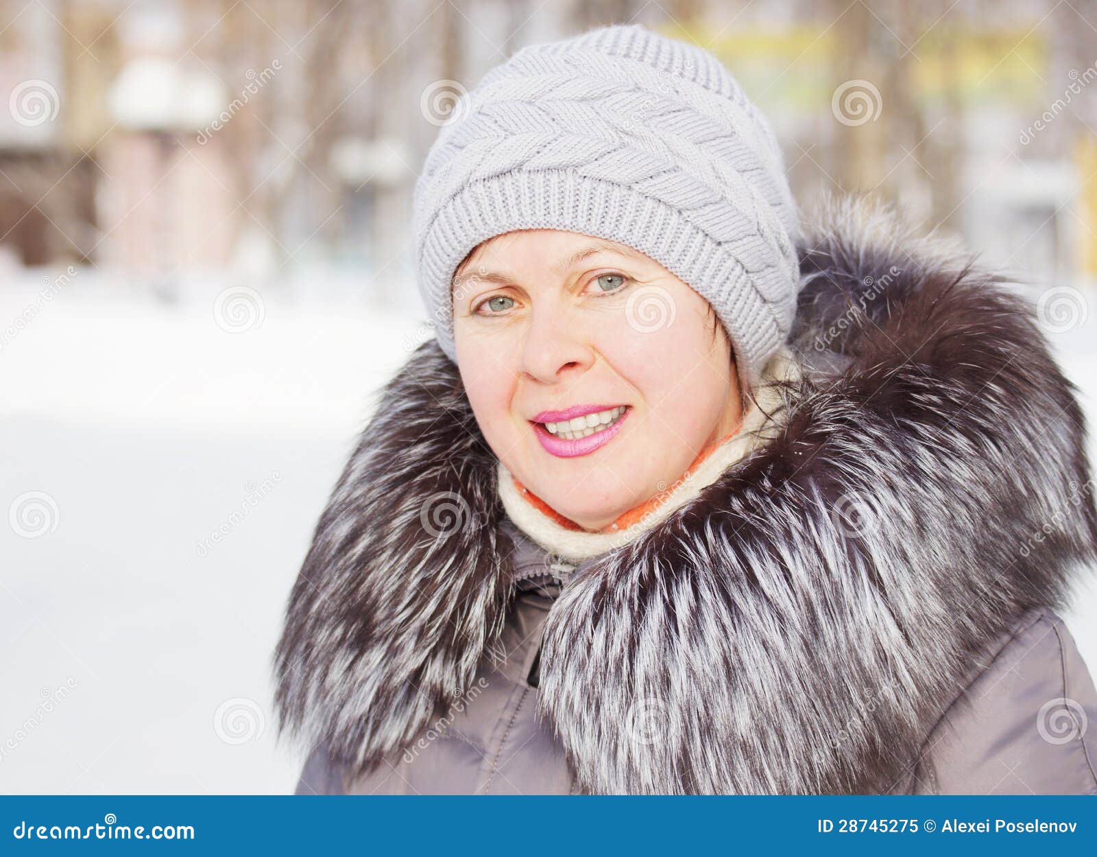 Beautiful Woman In A Coat With Fur Collar And A Knitted Hat Royalty ...