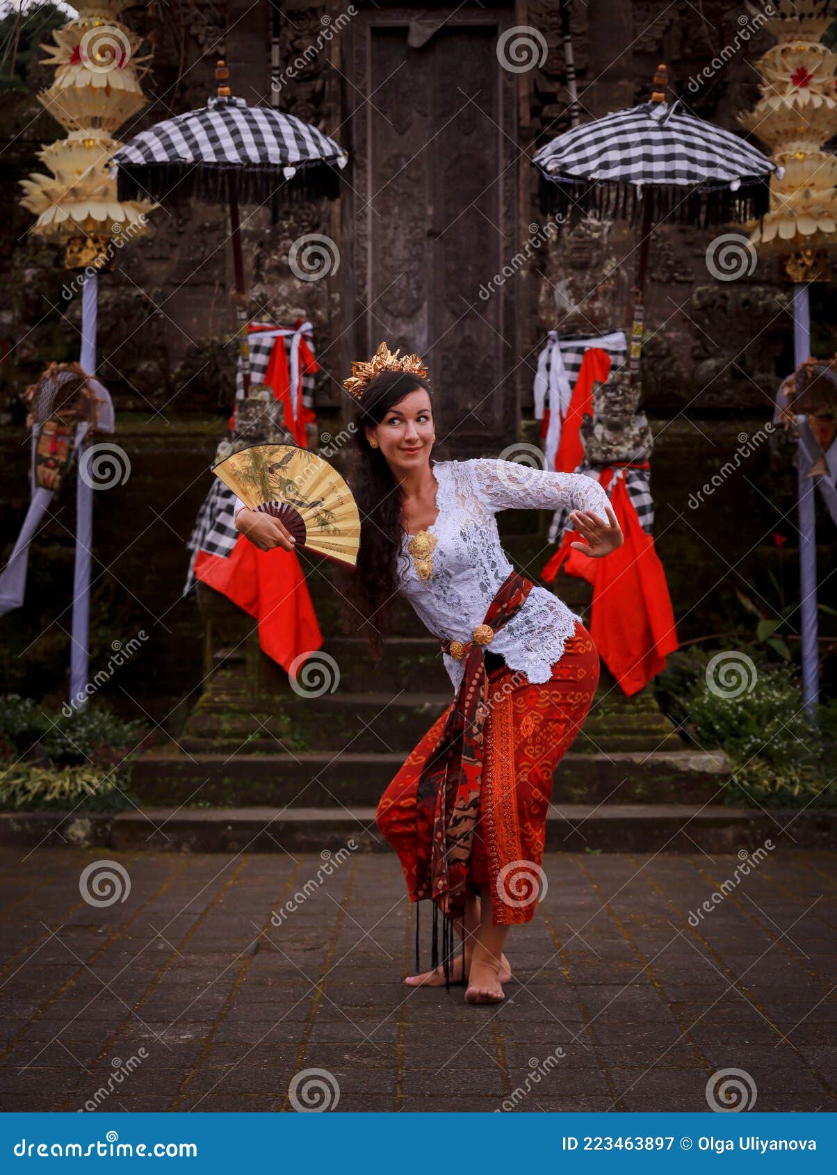 Woman Dancing Traditional Balinese Dance In Front Of The Temple Caucasian Woman Wearing