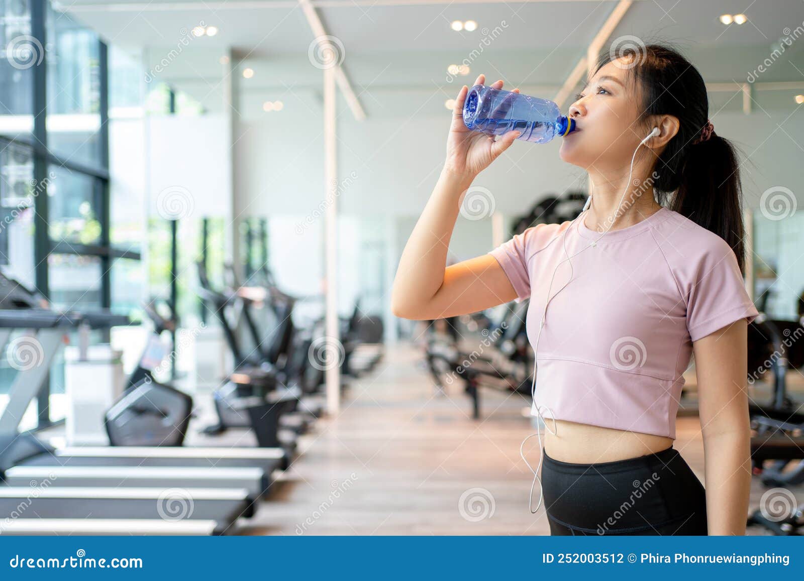 Beautiful Woman is Drinking Water while Practicing Muscles in the Gym Stock Photo Image of