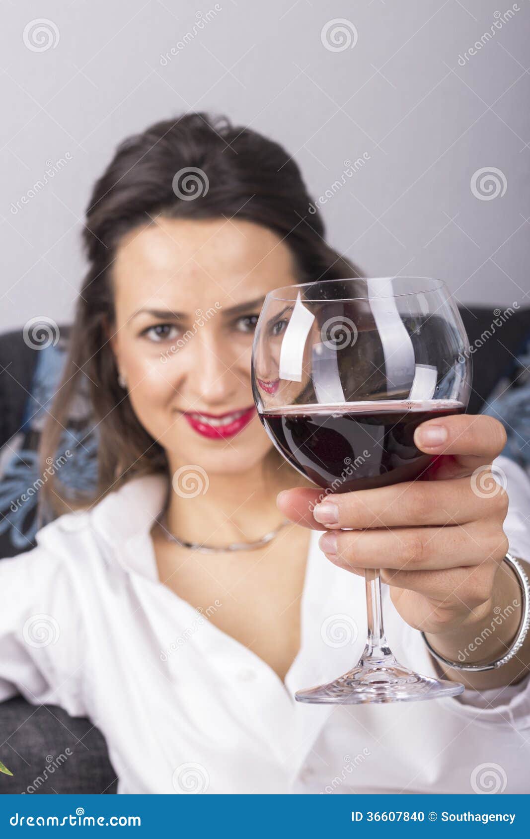 Beautiful Woman Drinking Wine Sitting on a Sofa Stock Photo - Image of ...