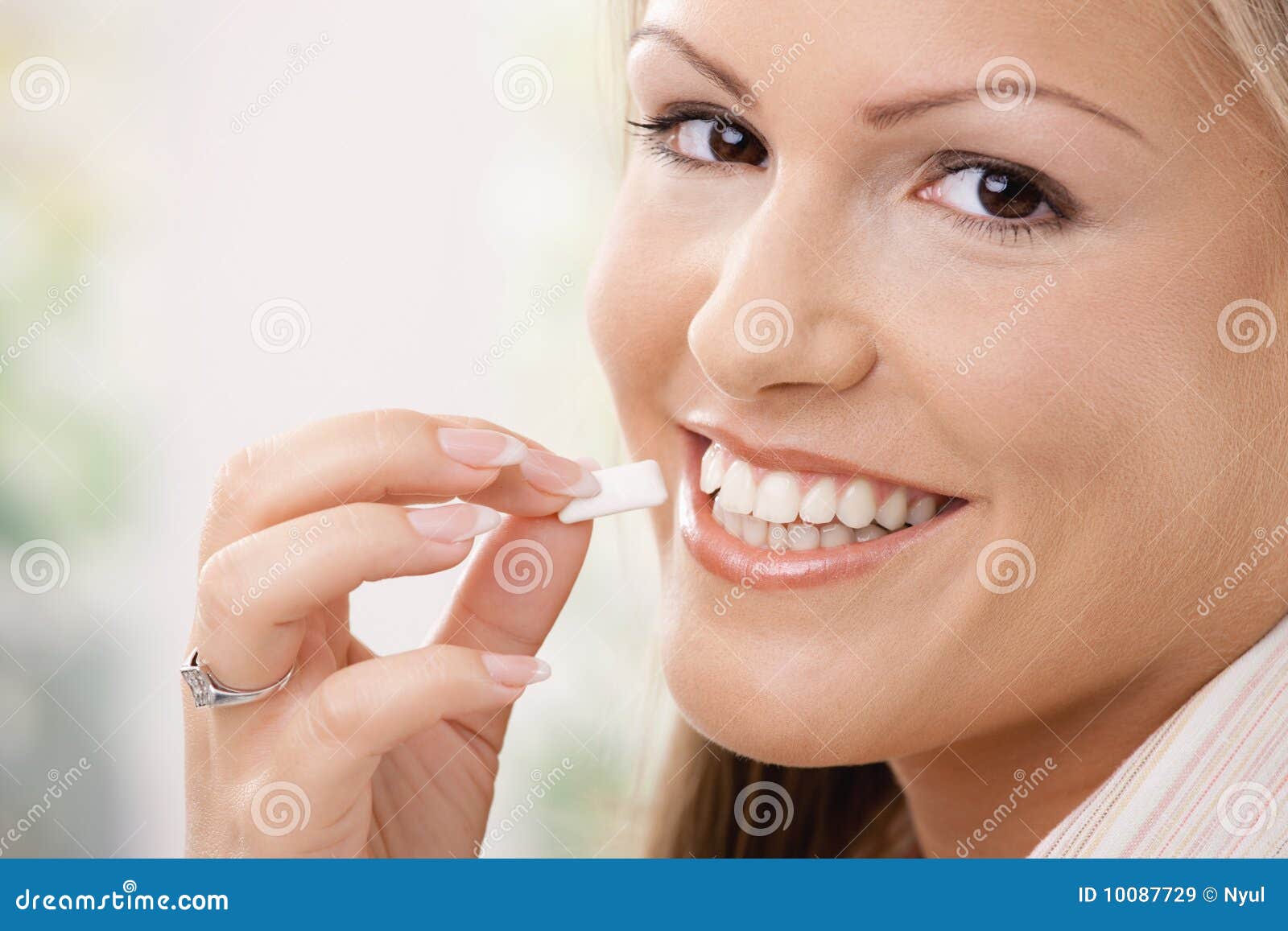 beautiful woman eating chewing gum