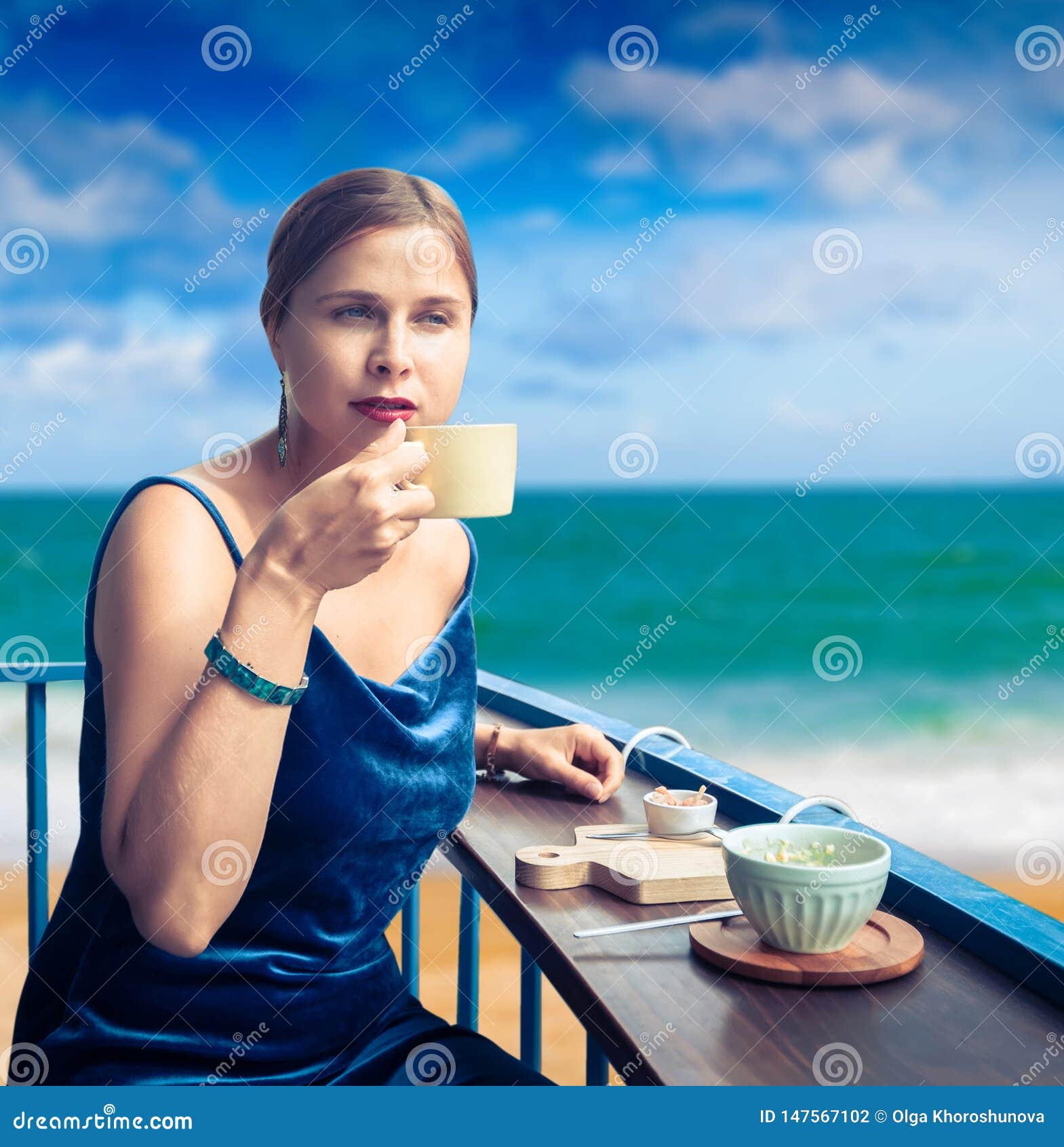 Beautiful Woman Enjoying Tea On Cafe Terrace At Seaside Stock Photo ...