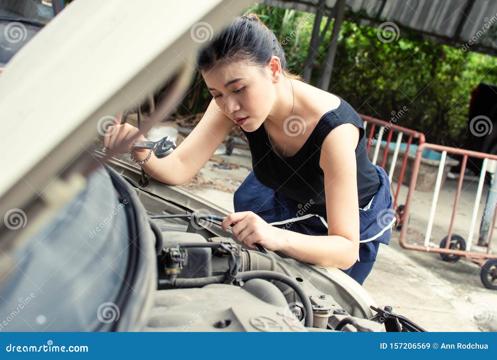 A Beautiful Woman is Fixing Broken Machine in Car Stock Image - Image of  caucasian, automotive: 157206569