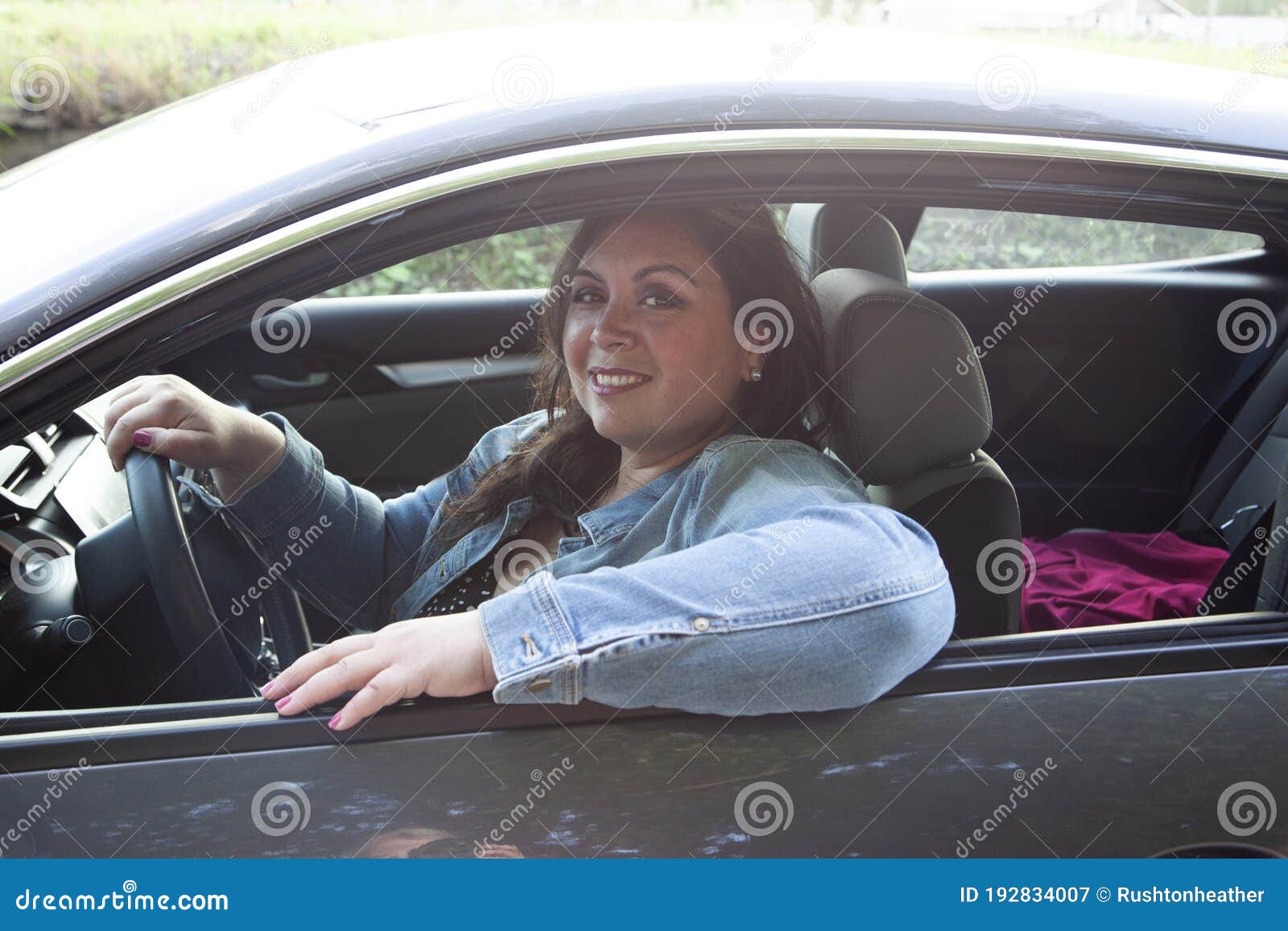 Gorgeous Latina Woman Looking Relaxed in Her Car Stock Image - Image of ...