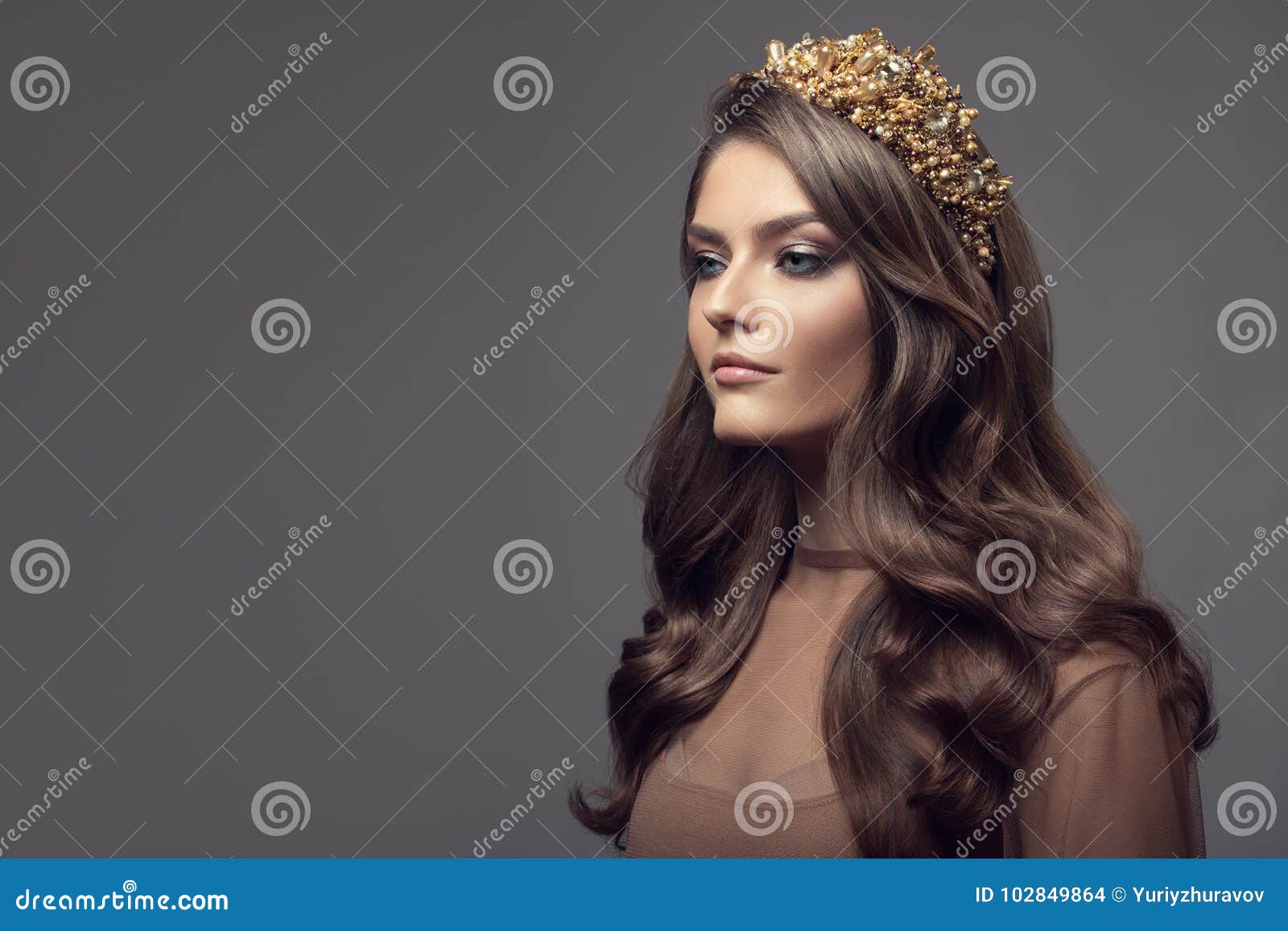 beautiful woman in gold crown on her head.