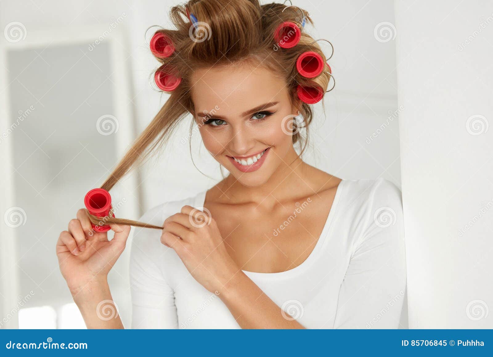 Beautiful Woman with Hair Curlers, Hair Rollers on Healthy Curly Stock