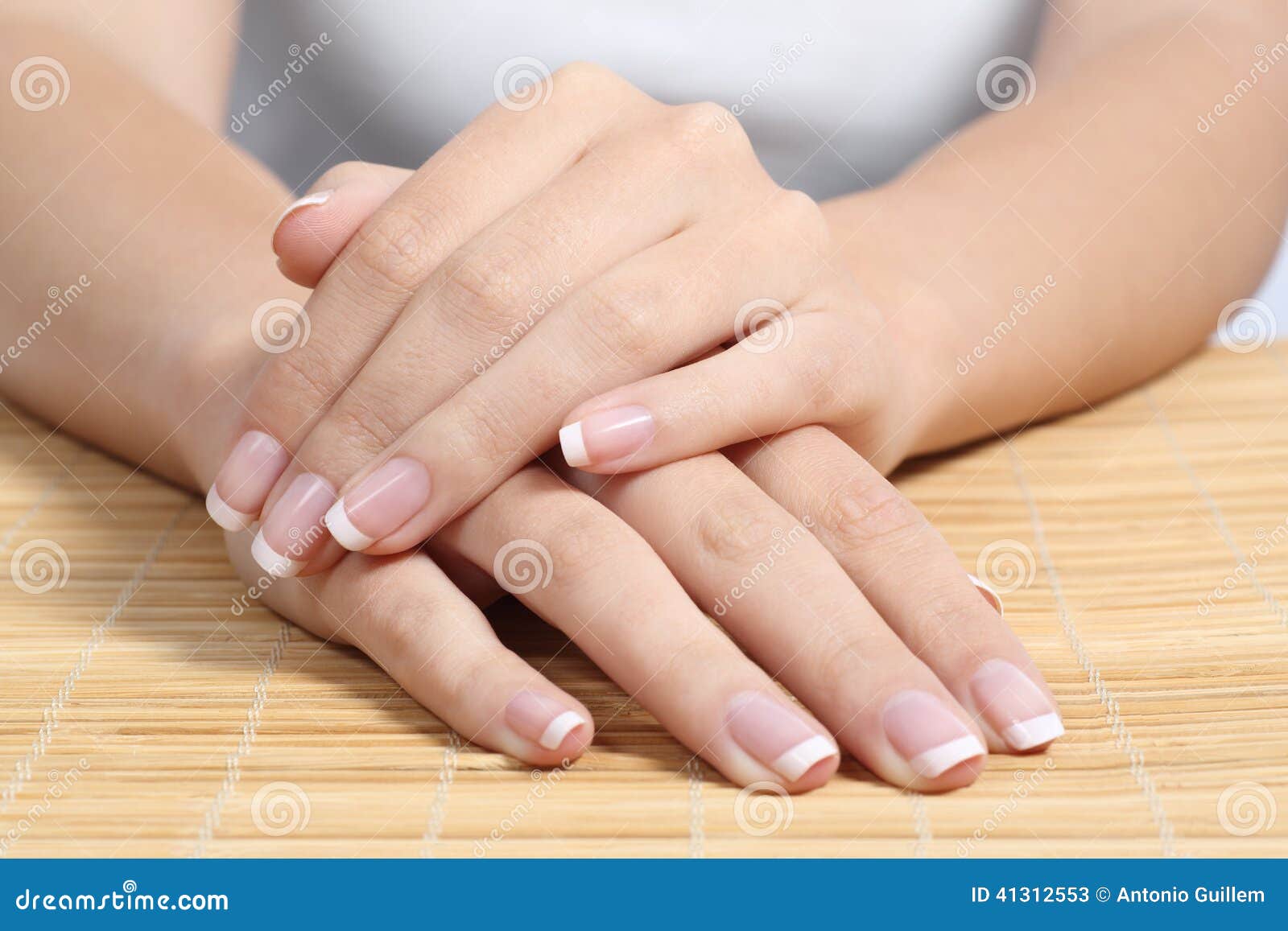beautiful woman hands and nails with perfect french manicure