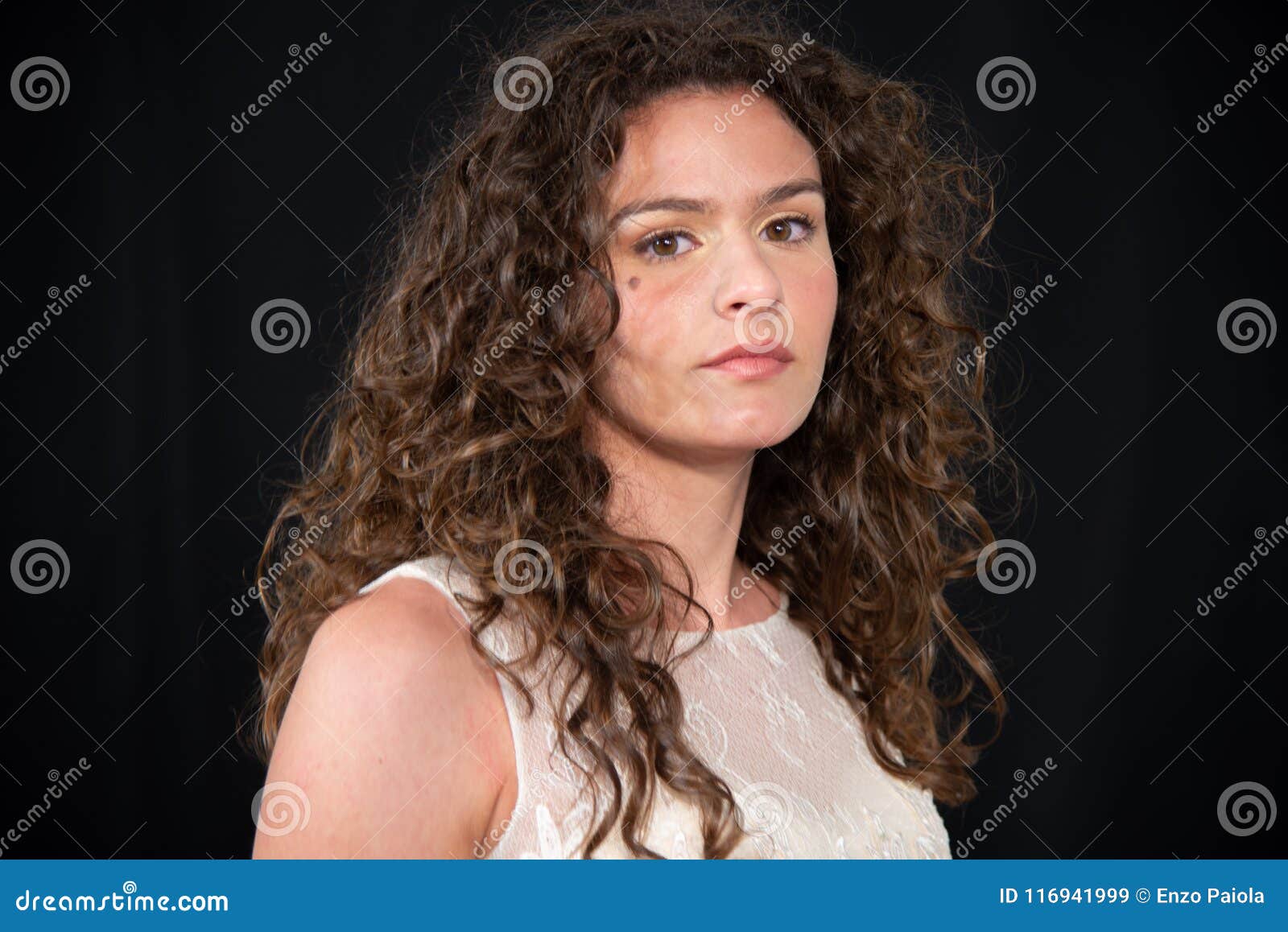 Close Up Of Girl With Brunette Curly Wavy Hairstyle Stock