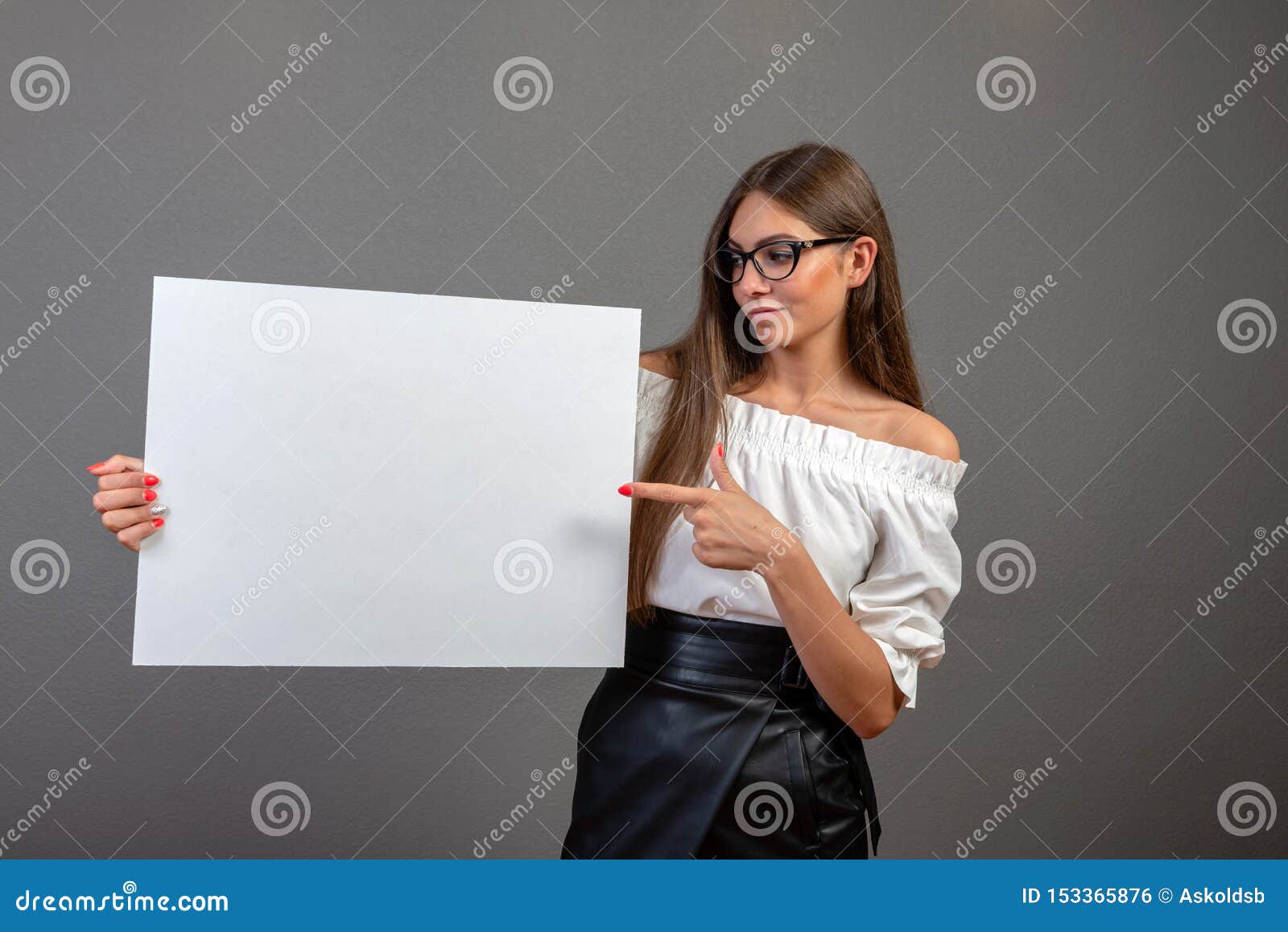 beautiful woman holding a blank billboard  on gray background - inage