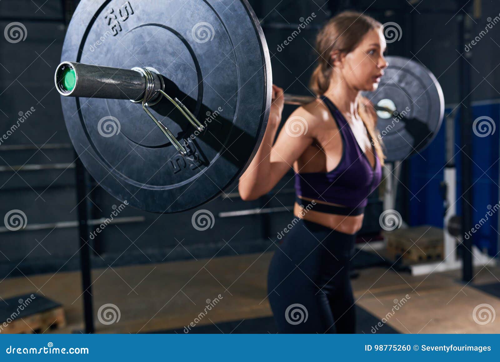 Beautiful Woman Holding Heavy Barbell in Gym Stock Photo - Image of ...