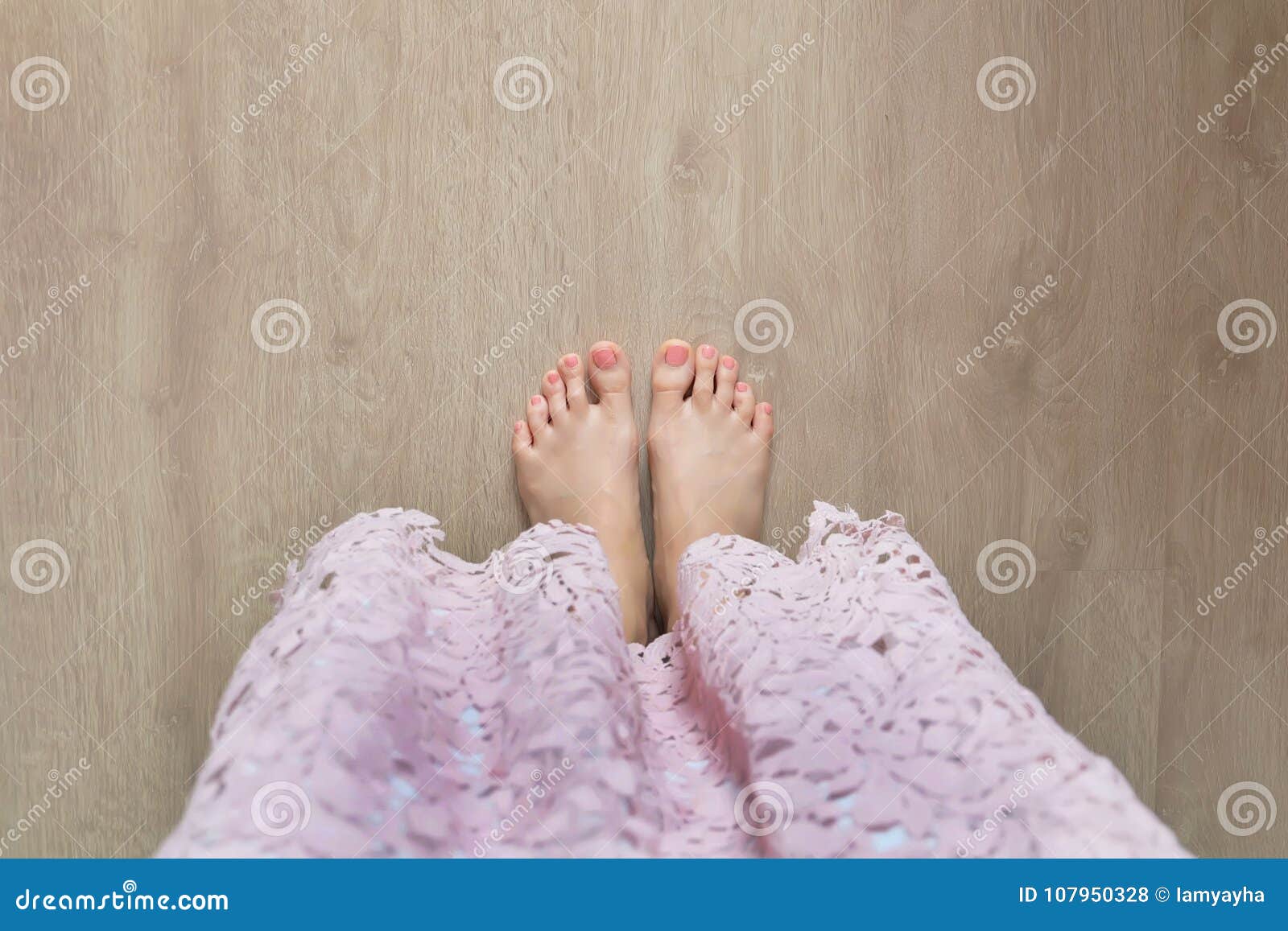 Female Barefoot Legs With Classic Red Pedicure Woman Raise Her Feet Up