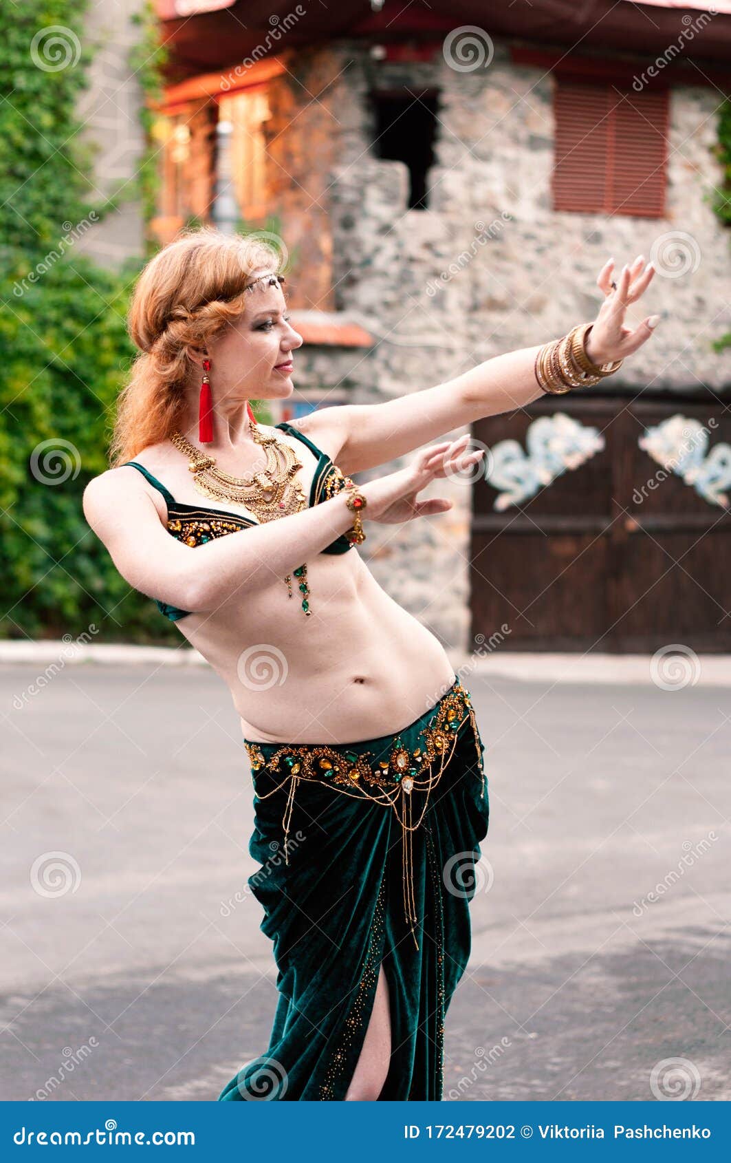 beautiful woman dancing in colorful Arabic dance costume. beautiful  brunette. long hair. - Stock Image - Everypixel