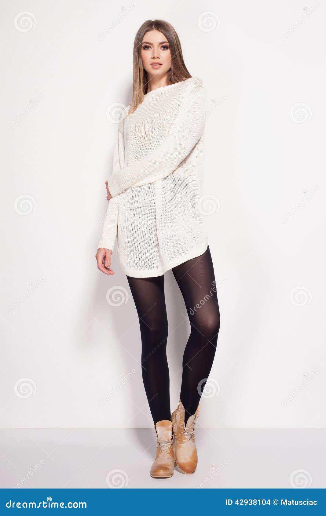Beautiful Woman with Long Legs Dressed Elegant Posing in the Studio ...