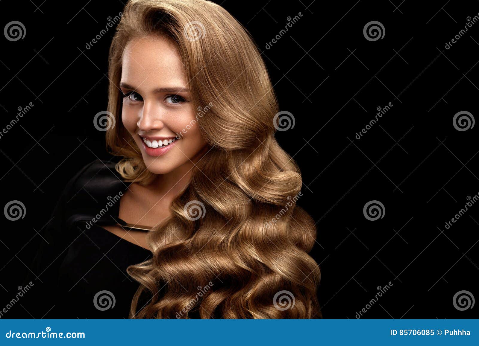 Beautiful Woman With Long Shiny Blonde Wavy Curly Hair