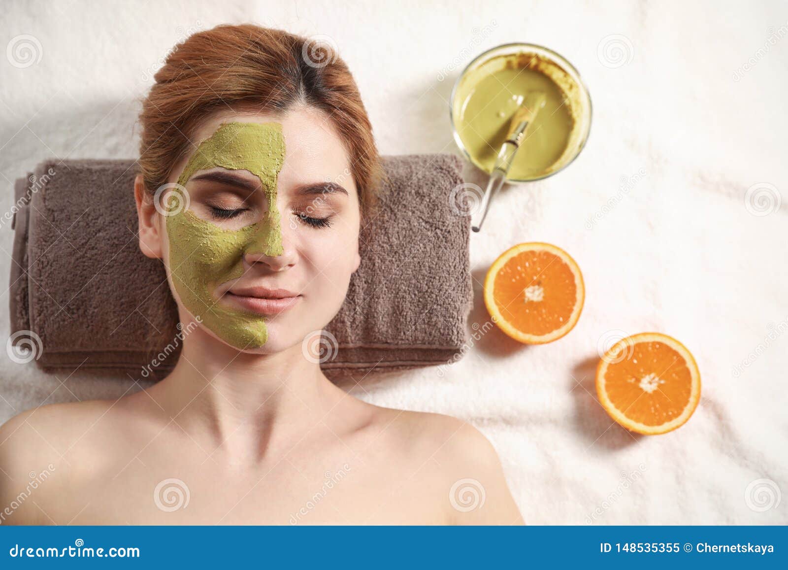 Beautiful Woman With Mask On Face Relaxing In Spa Salon Stock Image