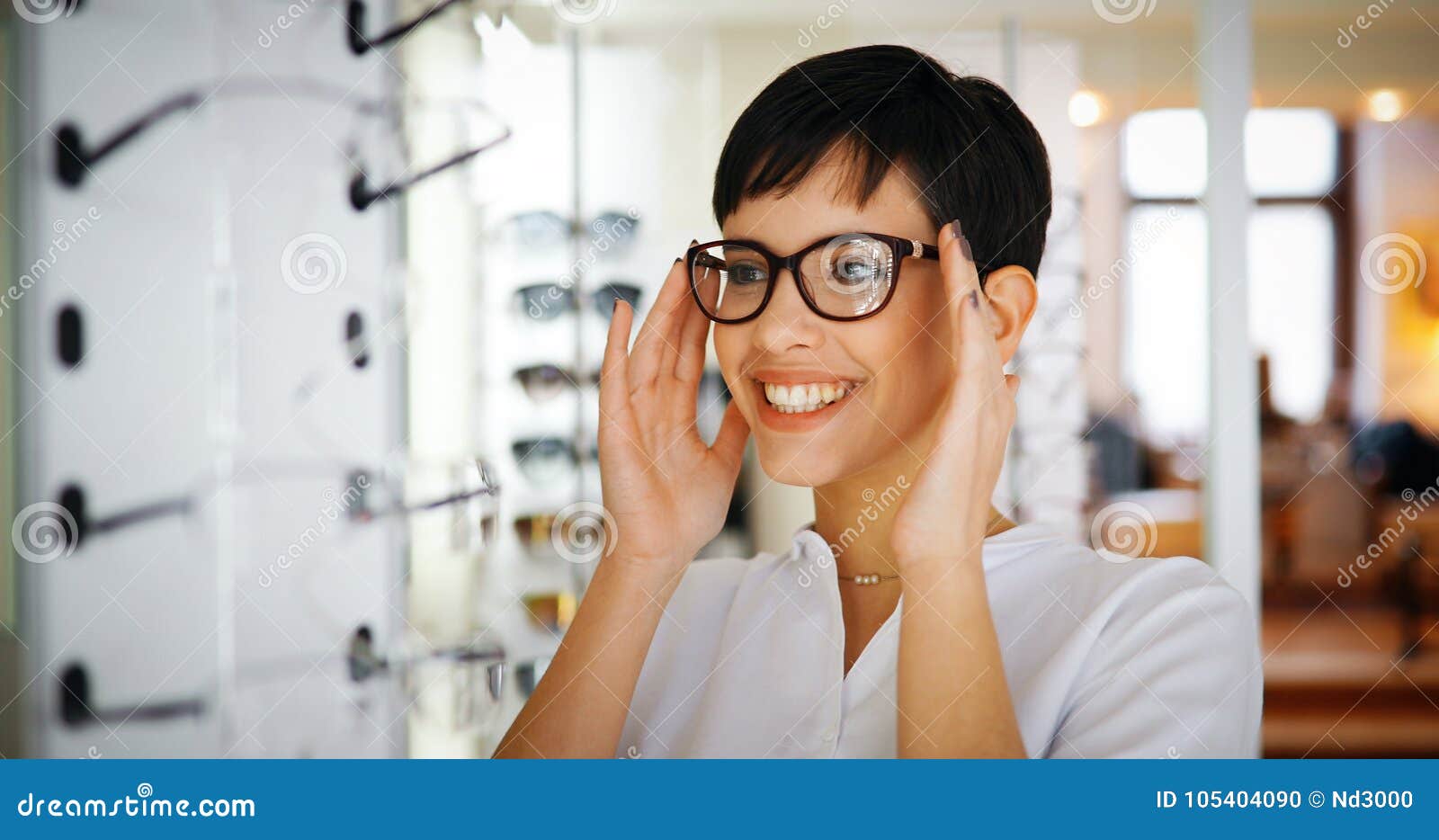 beautiful woman with optician trying eyeglasses