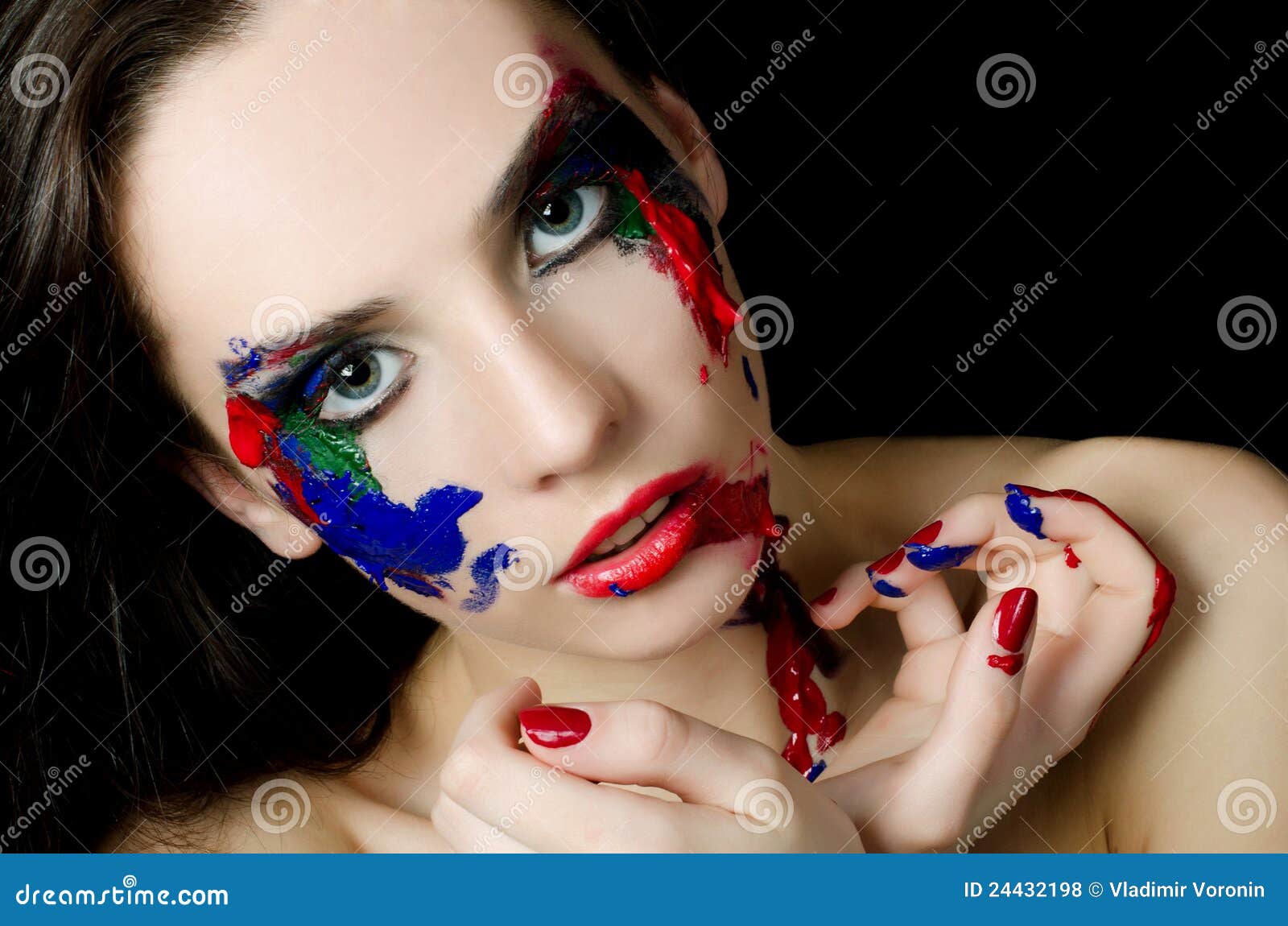 A Person with Red and Black Face Paint · Free Stock Photo