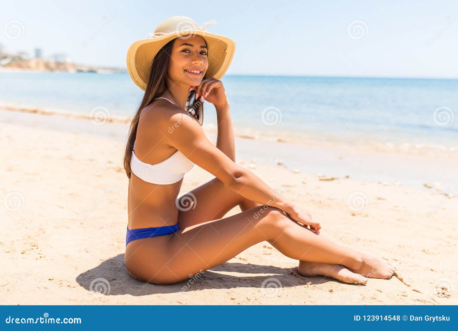 Beautiful Woman With Perfect Body Lying Down On The Beach Wearing 