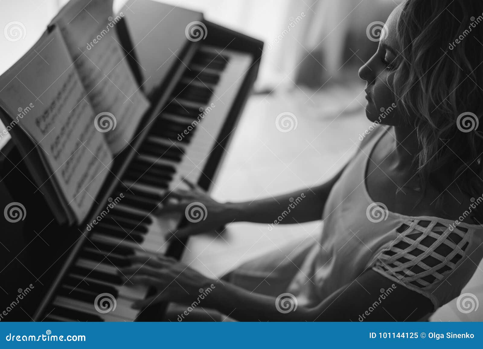 Beautiful Woman Playing Piano. Black and White Stock Image - Image of