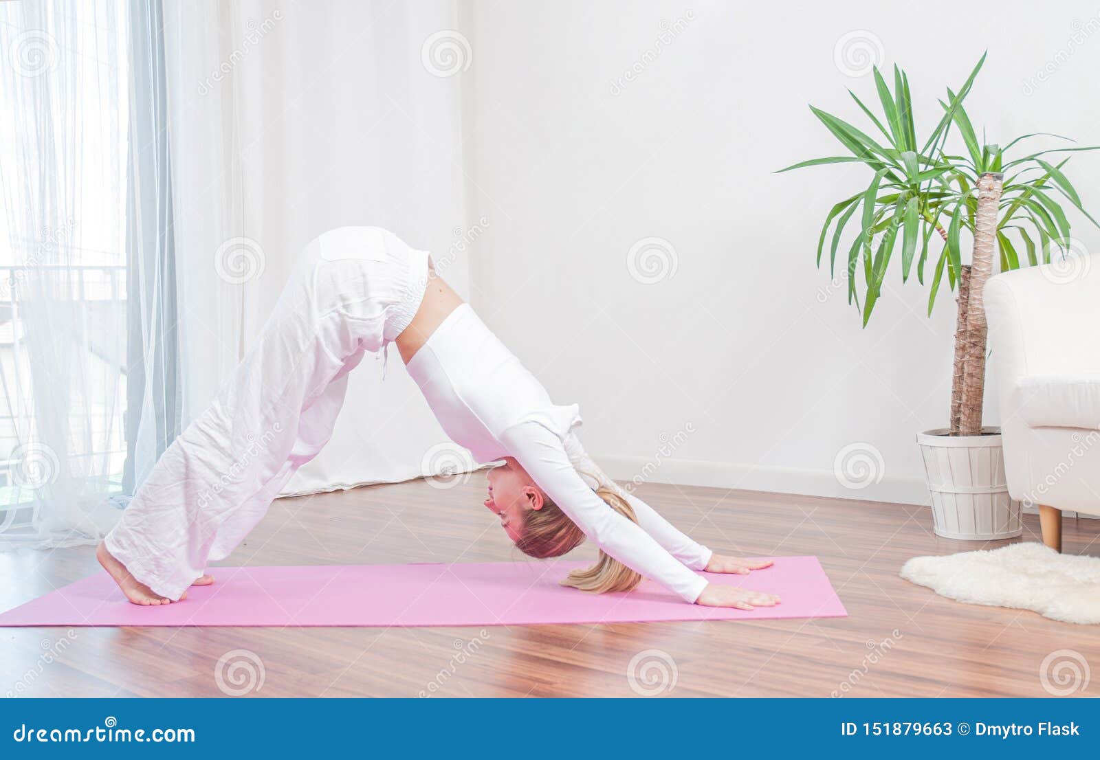 Beautiful Woman Is Practicing Yoga At Home On Yoga Mat ...