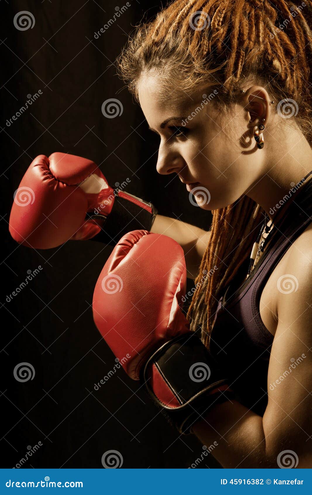 Beautiful Woman With Red Boxing Gloves Dreadlocks On A