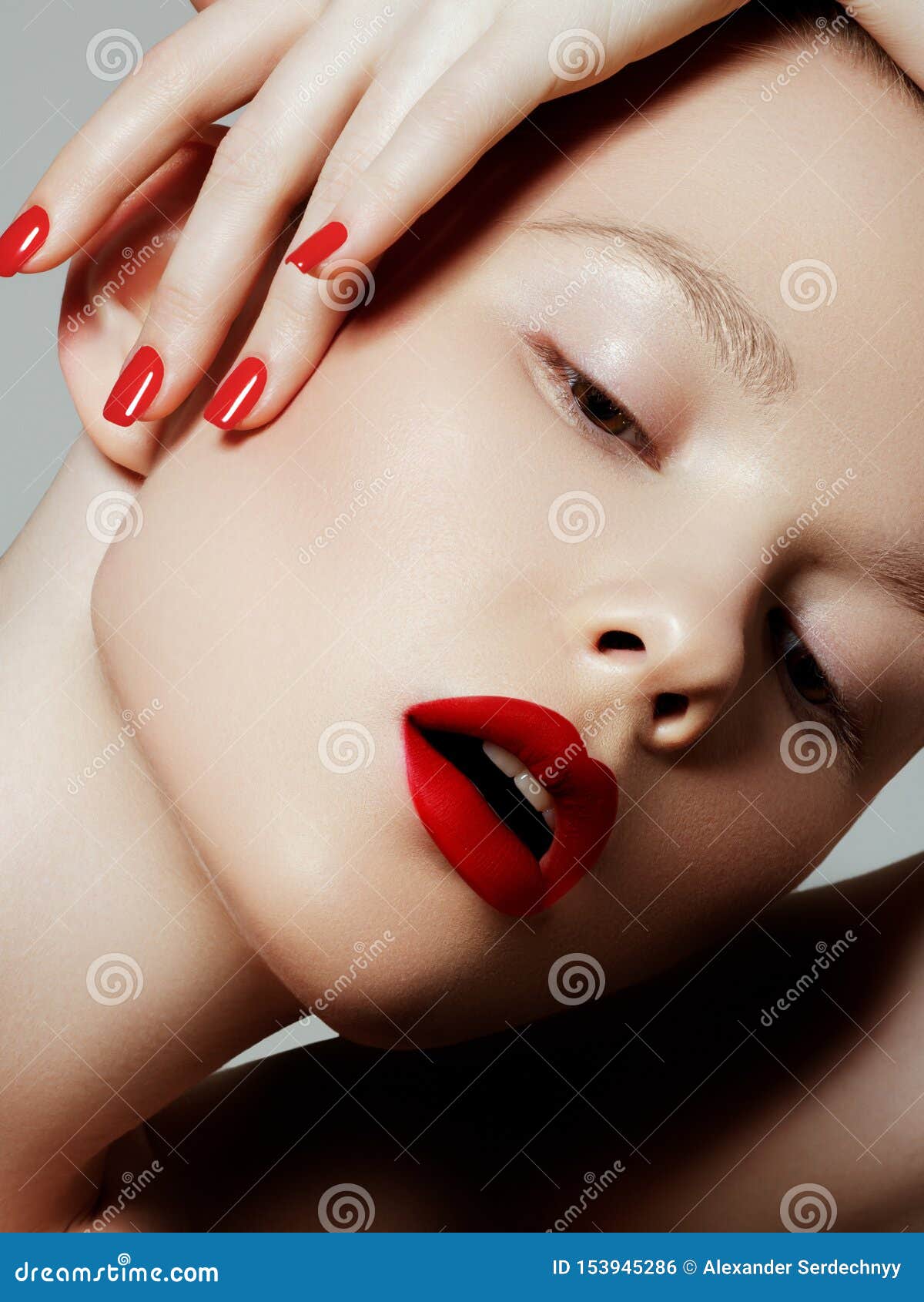 beautiful woman with red matte lipstick. beautiful woman face. makeup detail. beauty girl with perfect skin. red lips