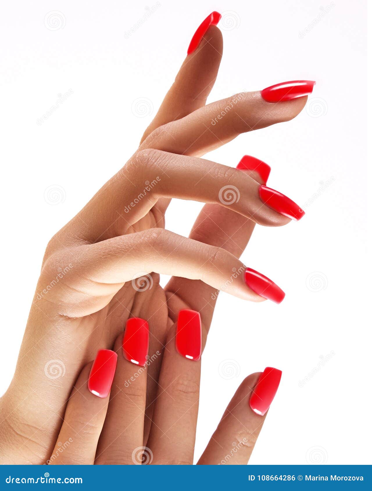 beautiful woman`s hands on light background. care about hand. redl manicure, clean skin. bright nails with polish