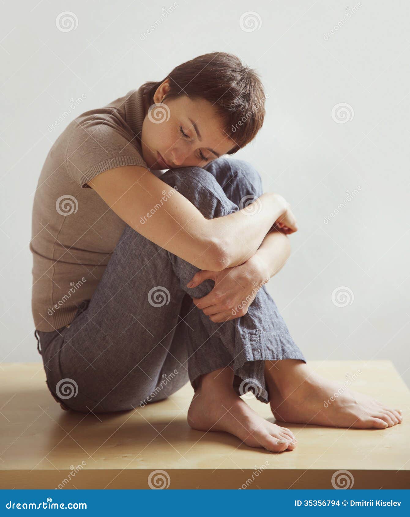 Beautiful Woman Sitting, Hugging His Knees Stock Photo - Image of