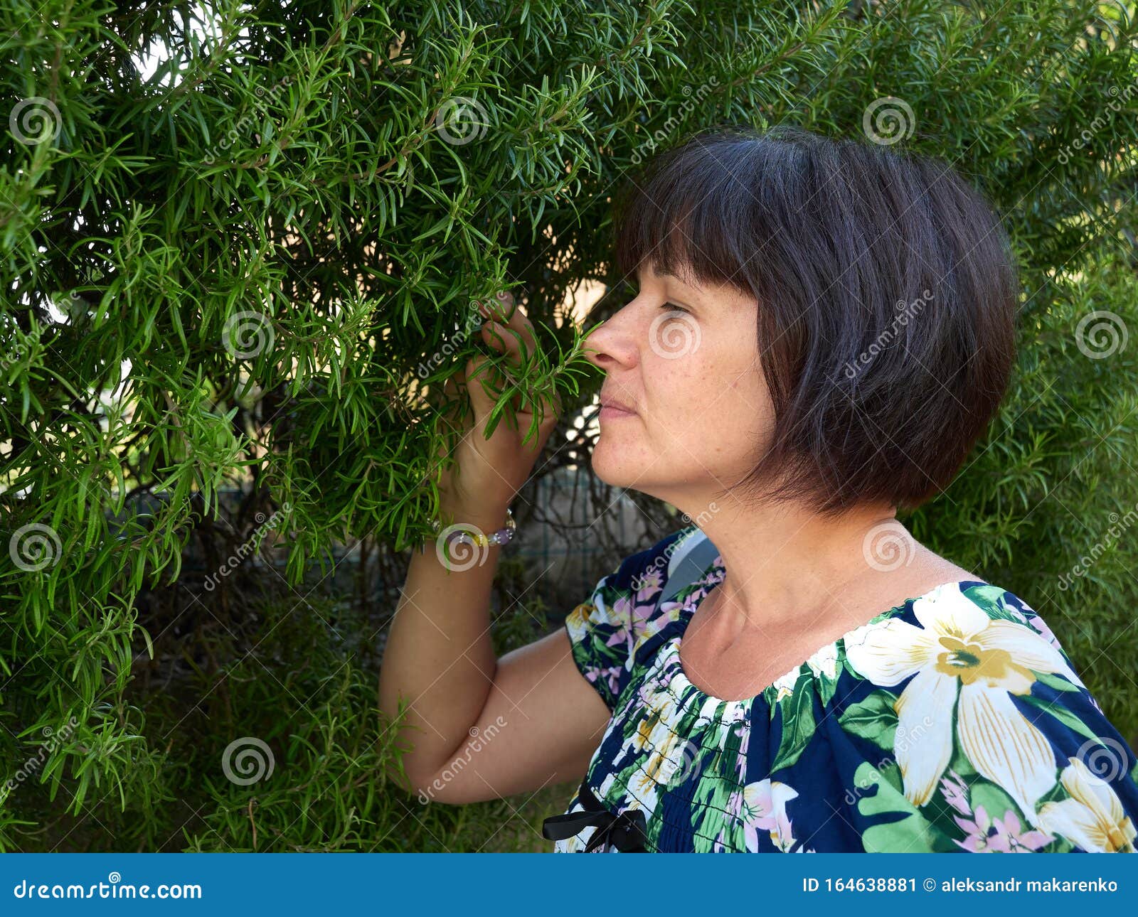 beautiful woman in the summer on the street of the old town arkua petrarka, italy