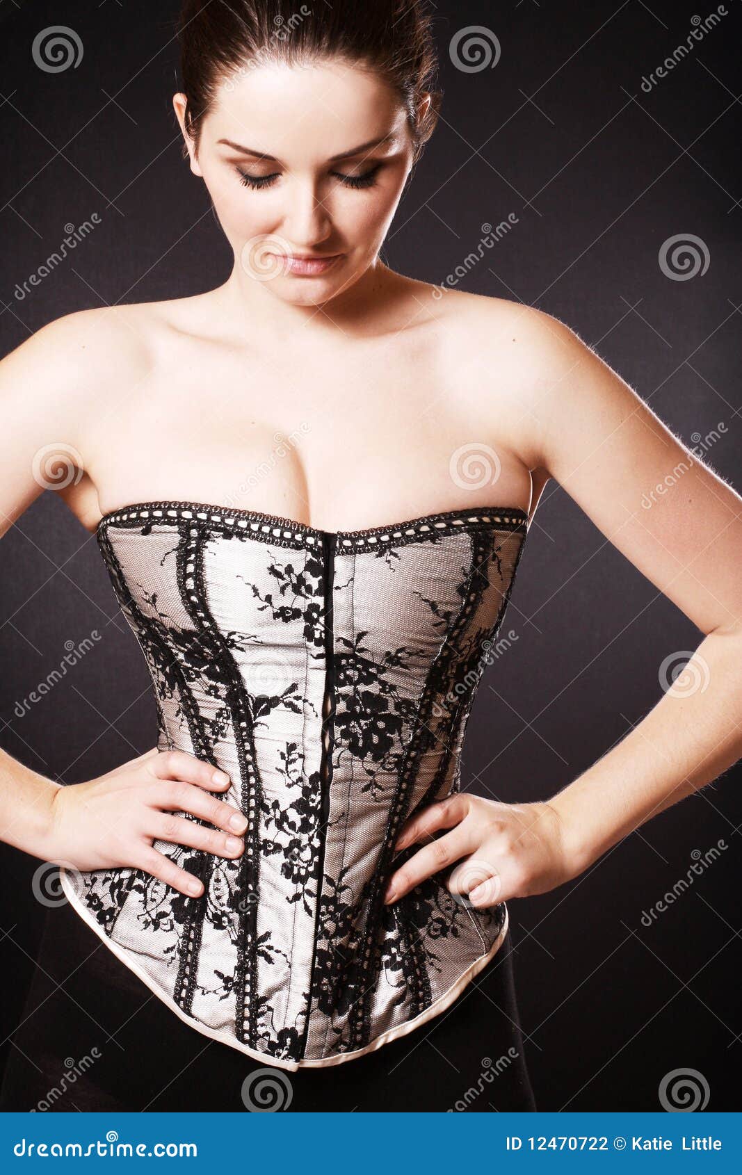 Premium Photo  A beautiful young woman in a white shirt and black corset  sits on a silvery background. sexy girl with professional makeup