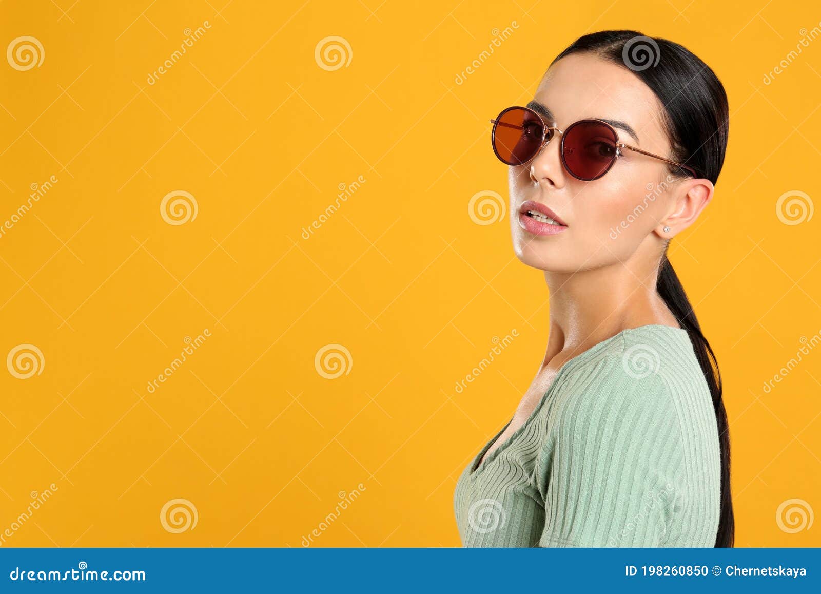 Beautiful Woman Wearing Sunglasses on Yellow Background. Space for Text ...
