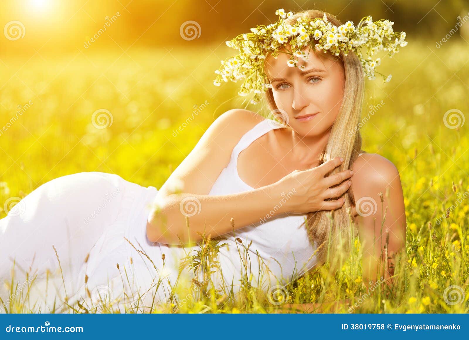 Beautiful Woman in Wreath of Flowers Lies in the Green Grass Out Stock ...