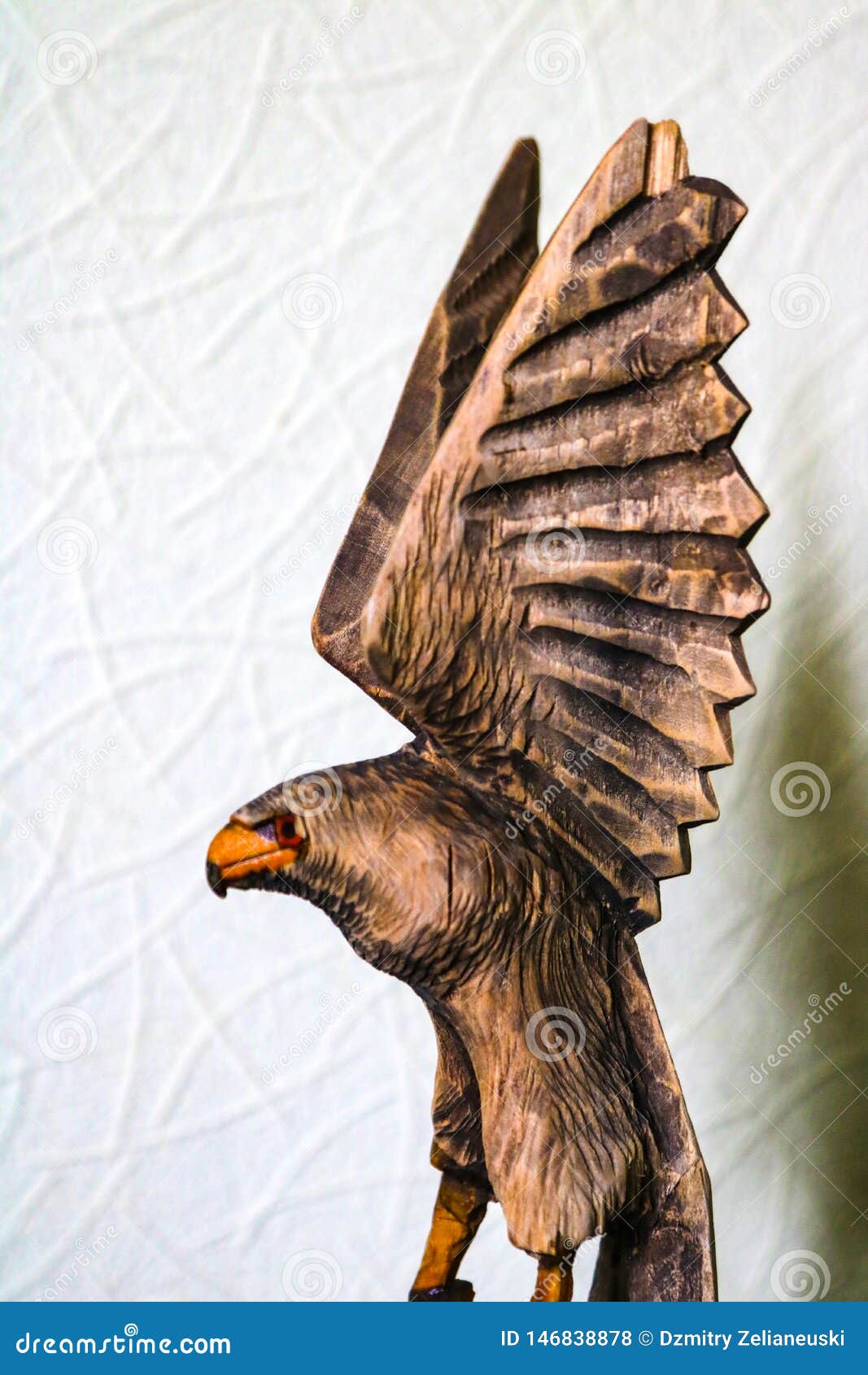 Beautiful Wooden Figure of an Eagle on a White Background Stock Photo