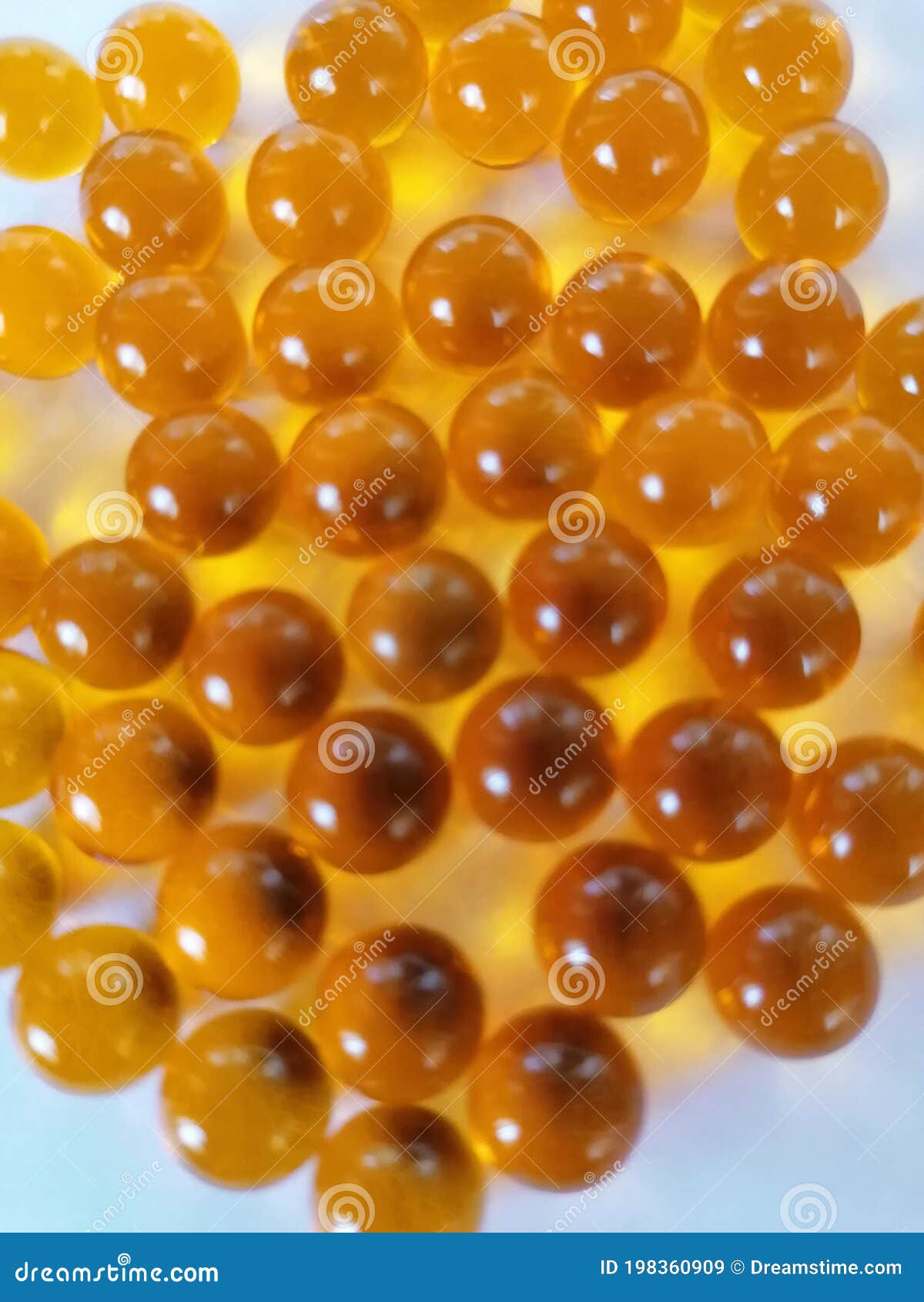 Beautiful Yellow Balls of the Same Size on a White Background. Stock